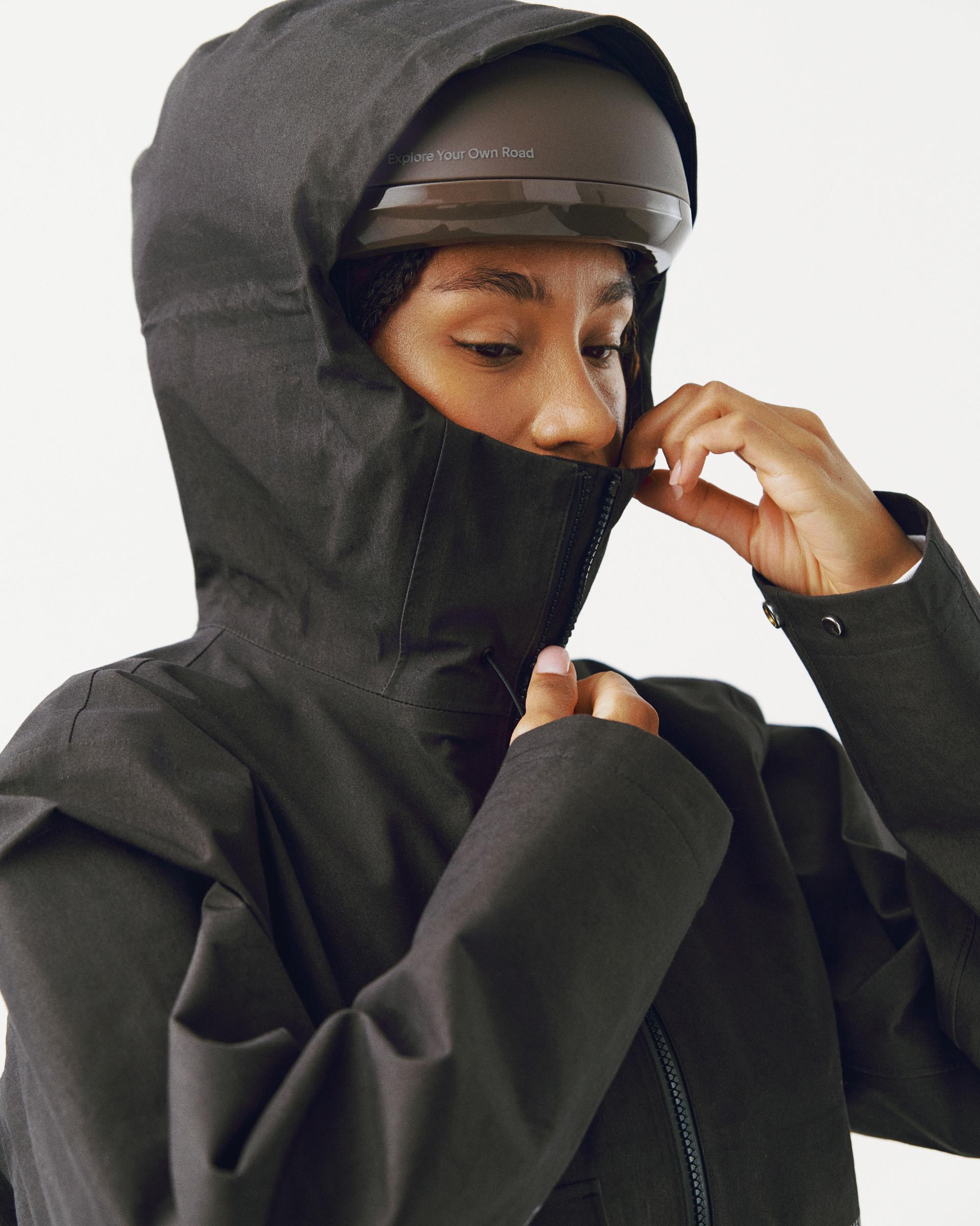 Dark Olive Off-Race 3L Cotton Shell jacket on model with hood up and face mask pulled down