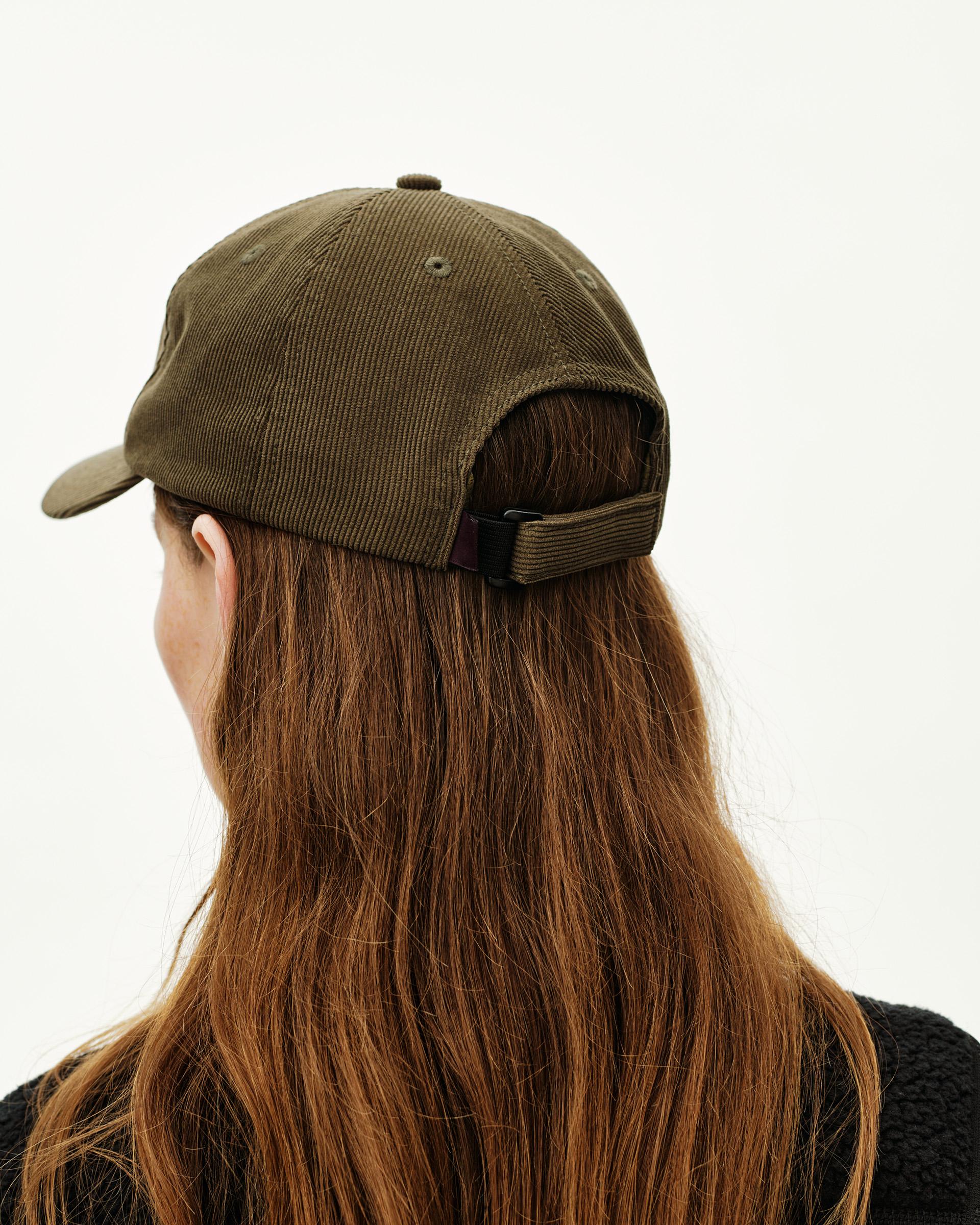 Deep Olive Off-Race Tech Corduroy cap on model, rear view with adjustable strap closure