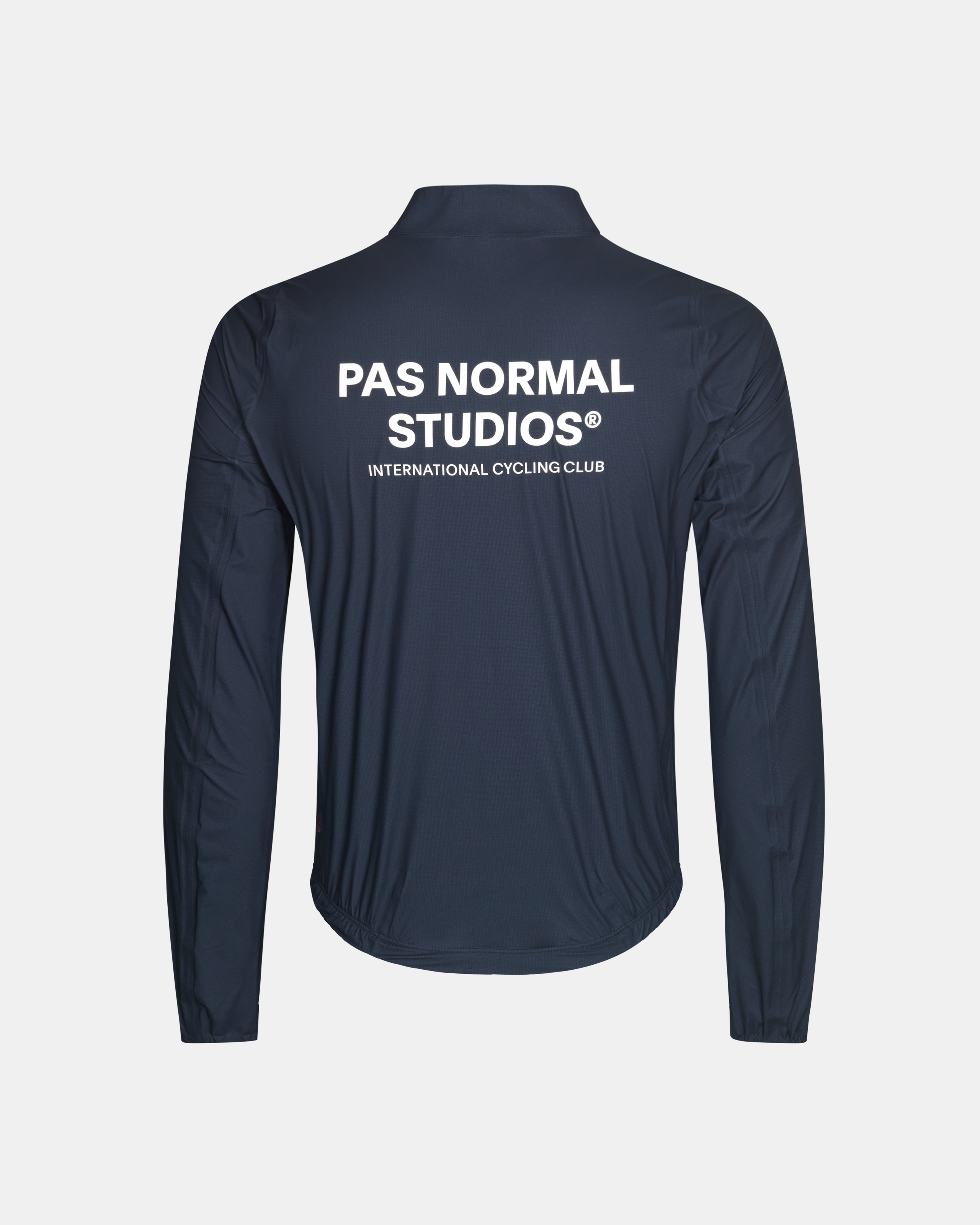 Navy Mechanism Pertex Rain cycling jacket, rear view with white brand text