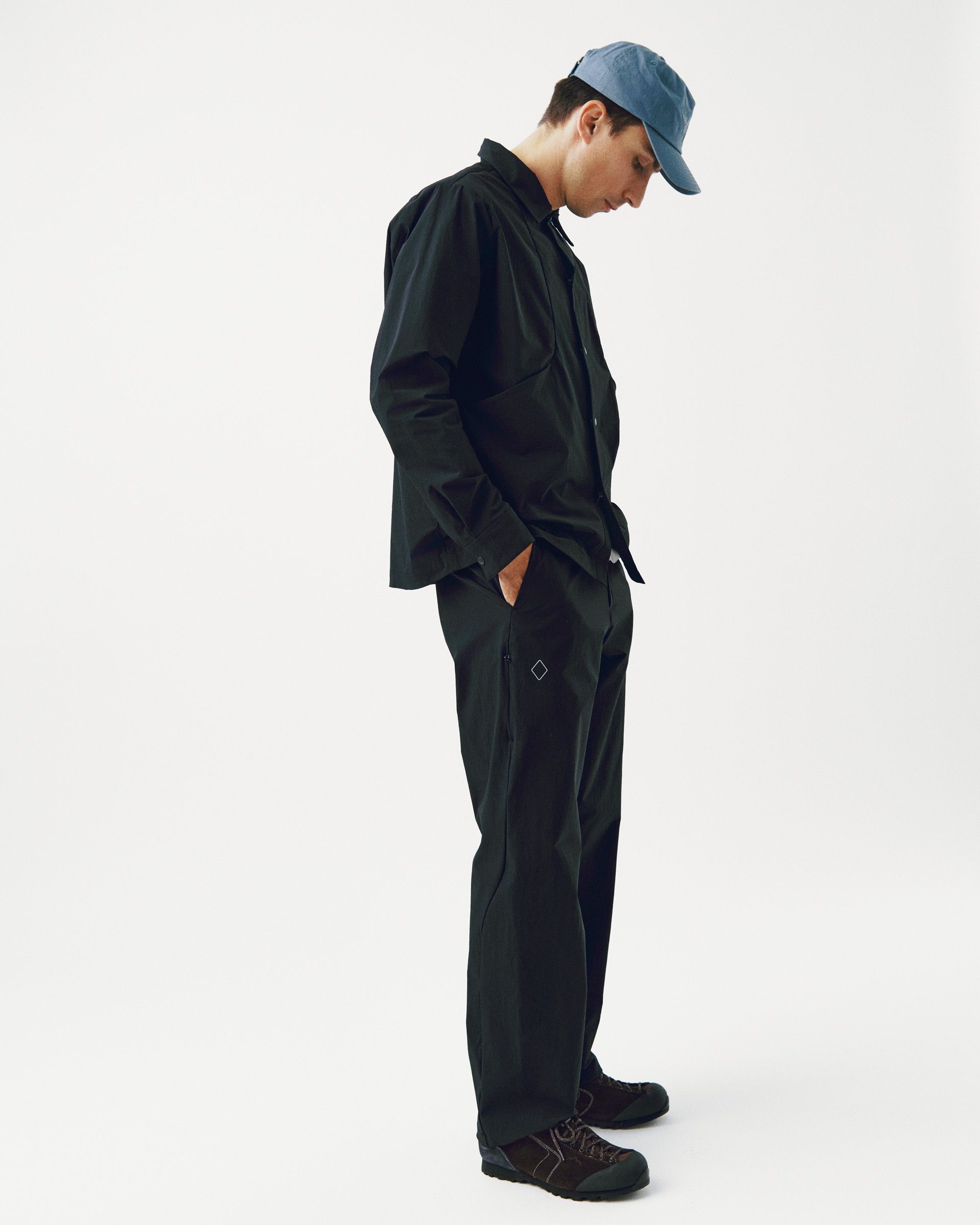 Black Off-Race Tech Overshirt on model, side view with relaxed fit and chest pocket