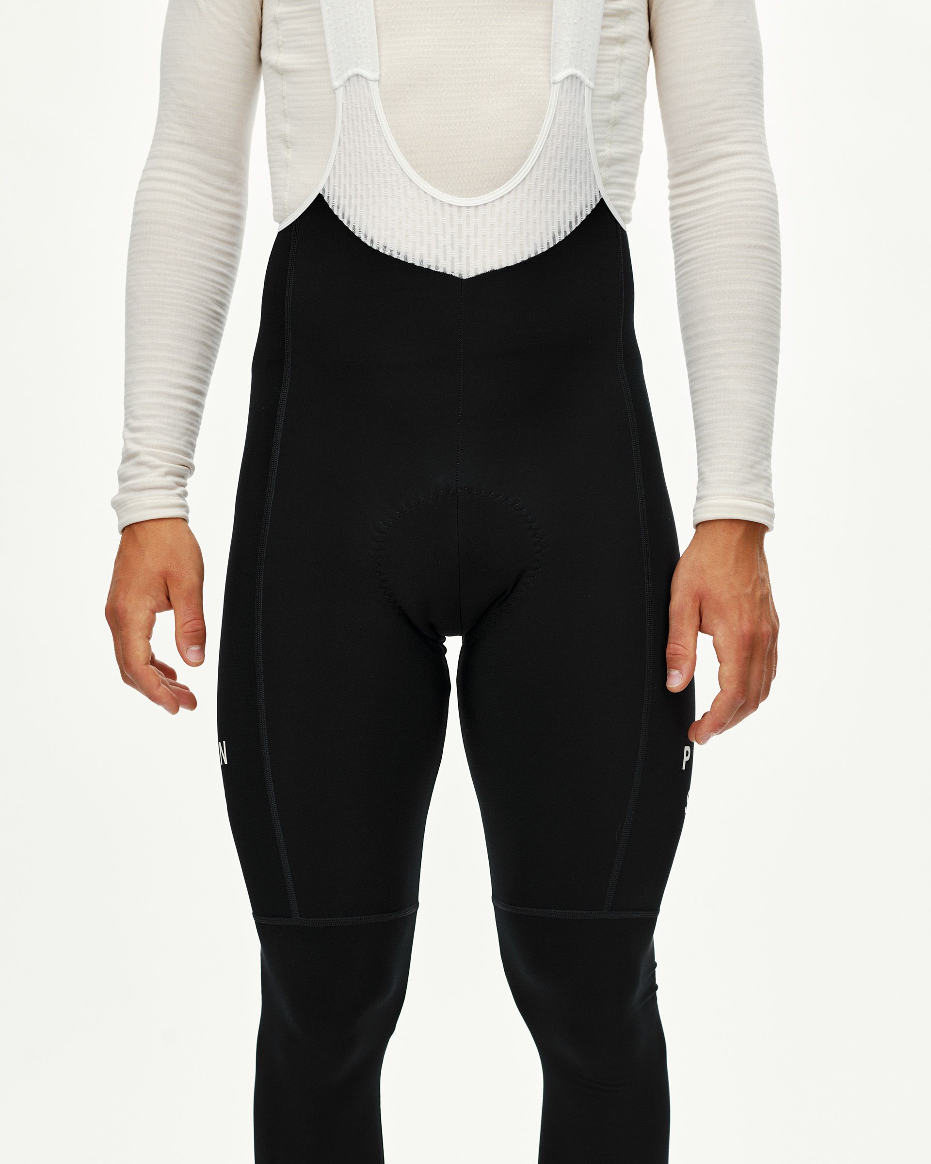 Black Mechanism Thermal Long Bibs on model, front view with white bib straps visible