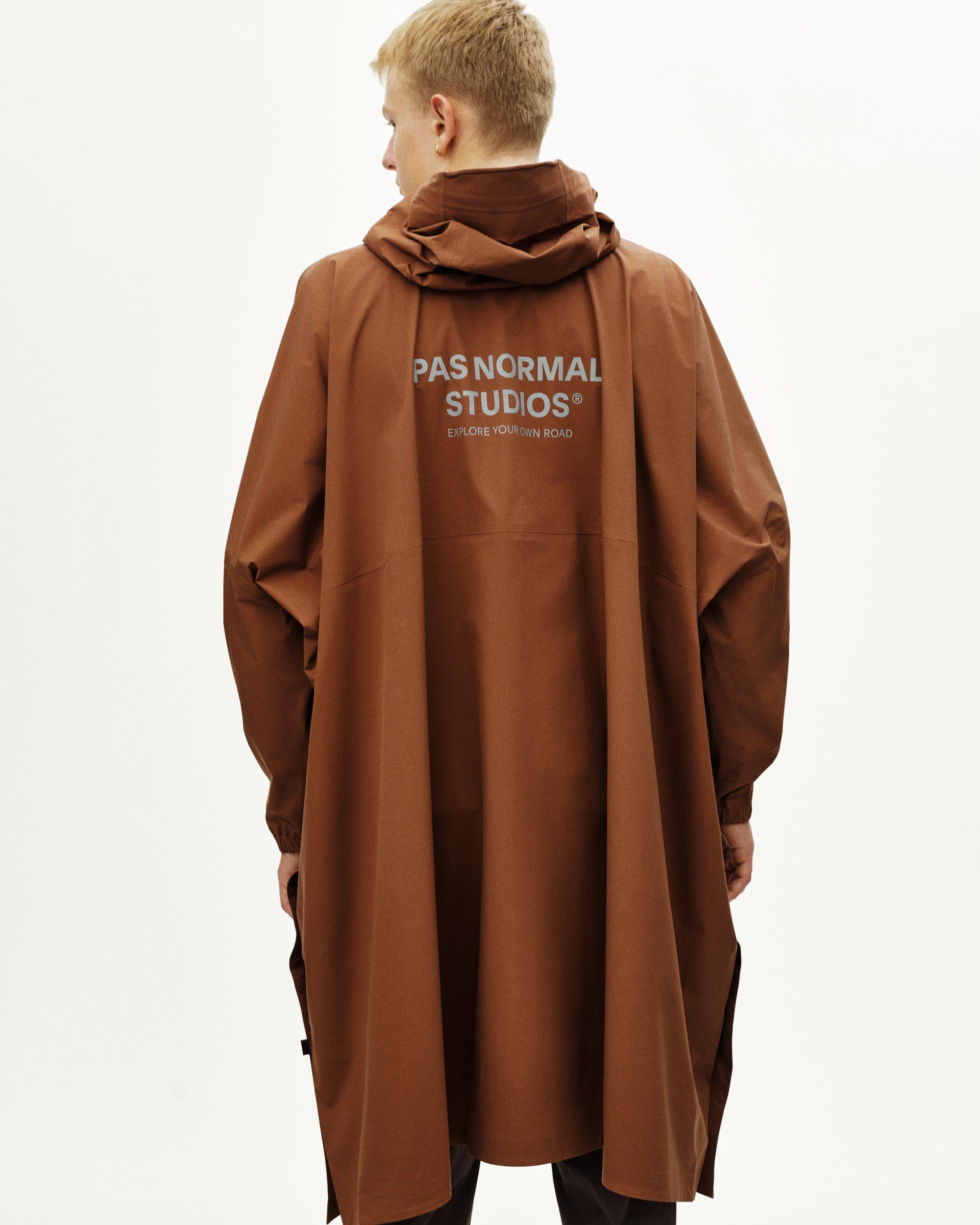 Brown Off-Race 3L Poncho, rear view on model with white logo print