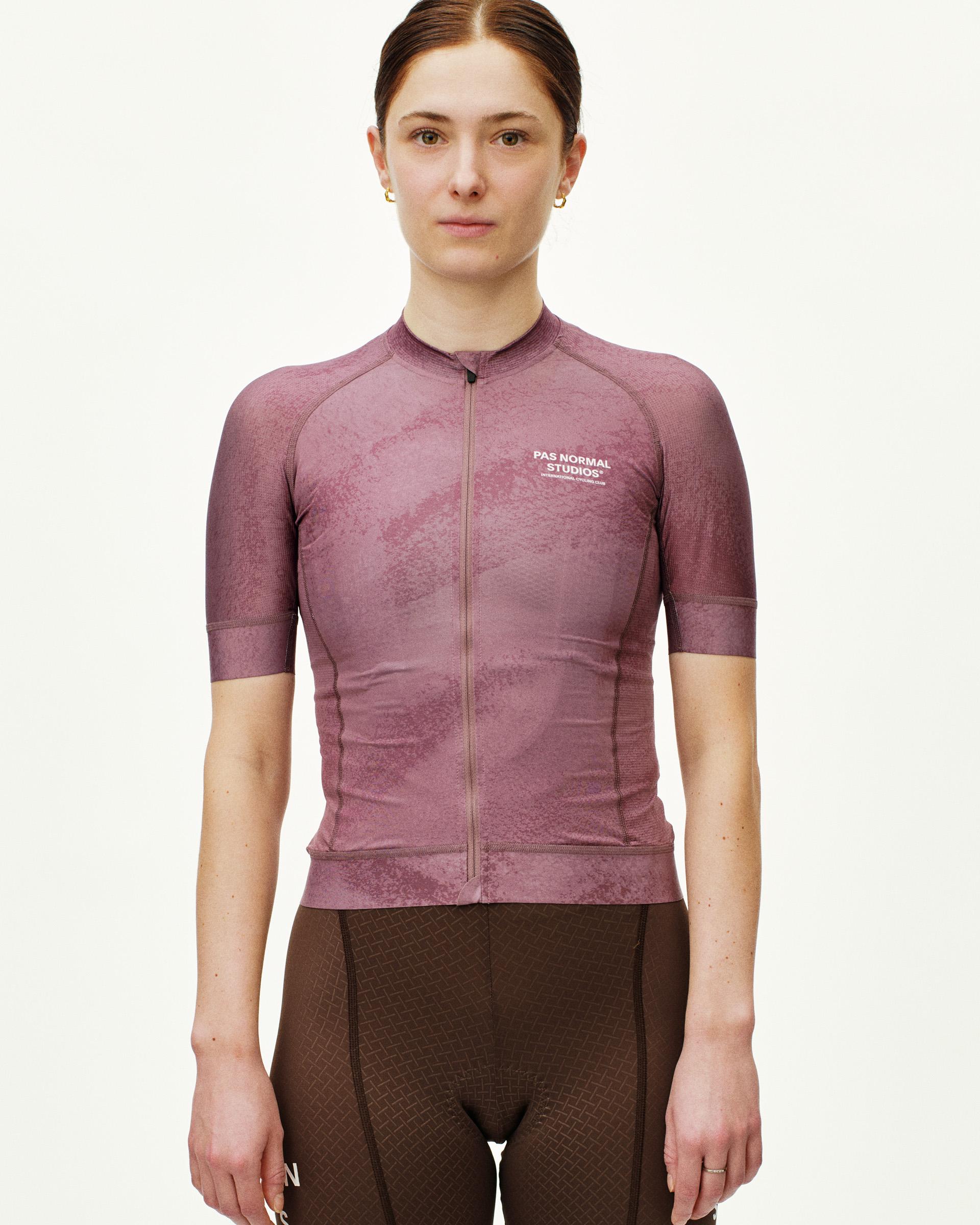 Purple Mechanism cycling jersey on model, front view with textured pattern and white chest logo