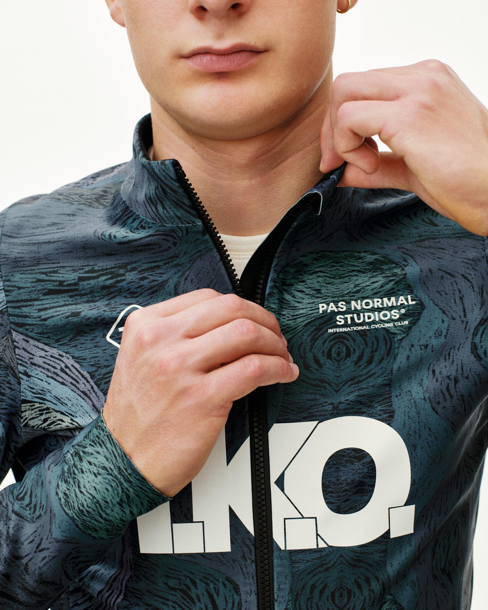 Dark Multi T.K.O. Mechanism Thermal cycling jacket, front detail on model with all-over print and large chest logo