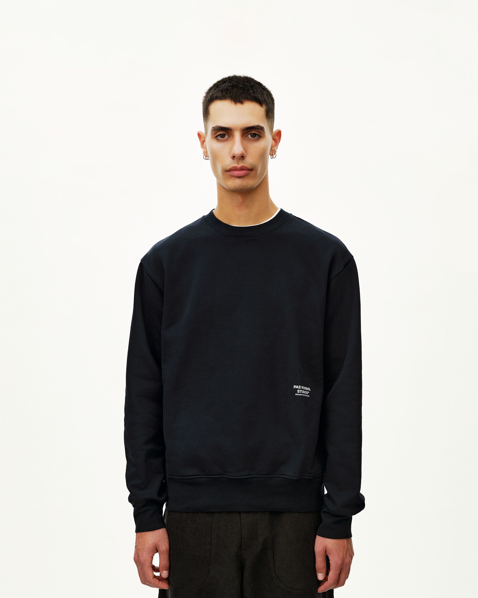 Black Off-Race sweatshirt on model, front view with small chest logo print