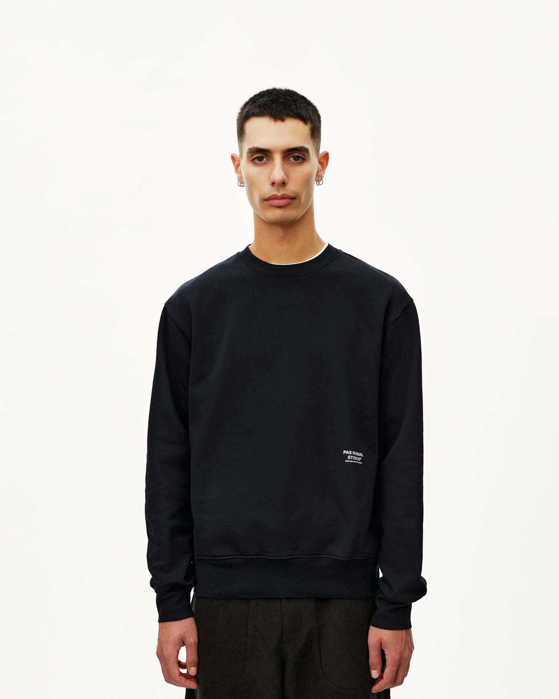 Black Off-Race sweatshirt on model, front view with small chest logo print
