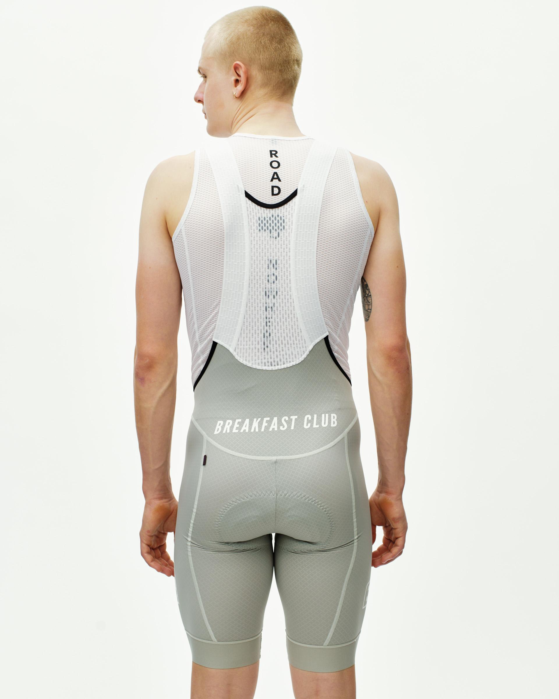 Light Grey Breakfast Club Mechanism bibs on model, rear view with white mesh back panel