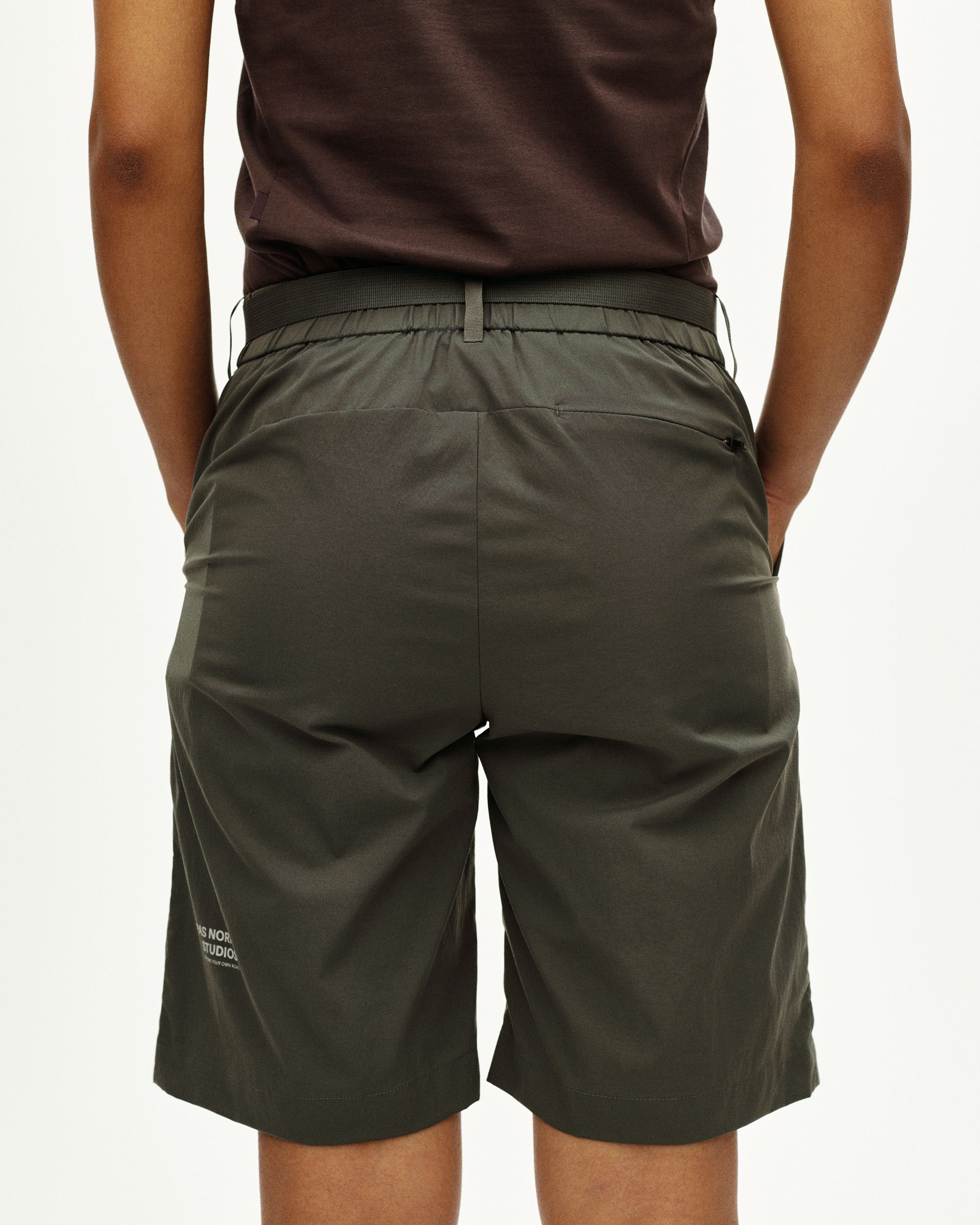 Dark Grey Off-Race Light Tech shorts, rear view on model with elastic waistband