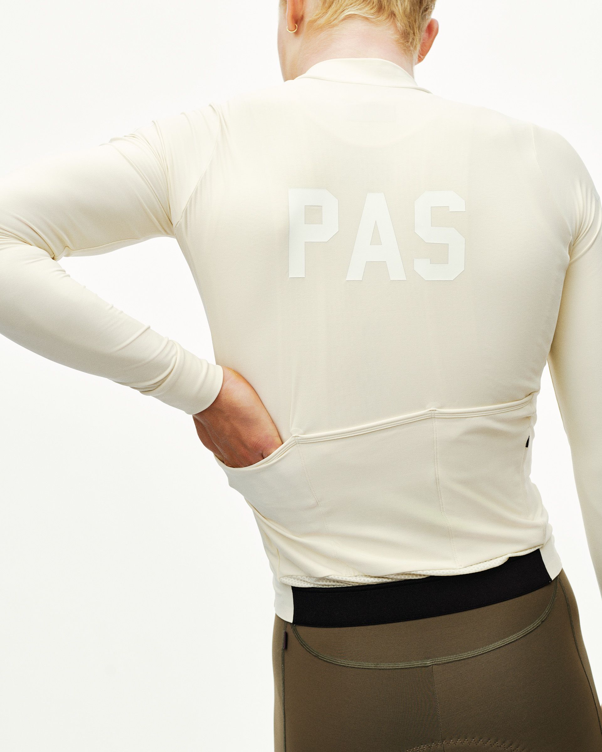 Sand PAS Mechanism long sleeve cycling jersey on model, rear view with tonal back print and rear pockets