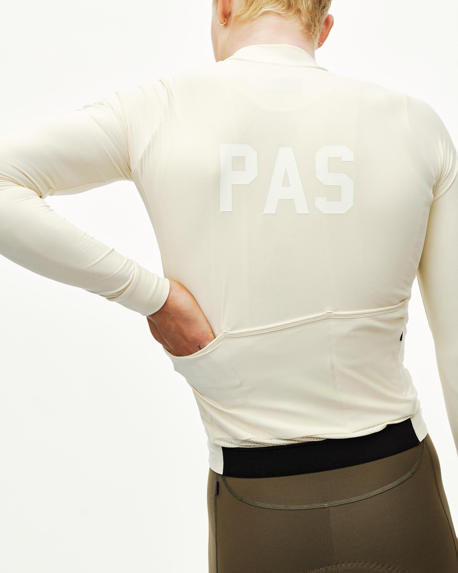 Sand PAS Mechanism long sleeve cycling jersey on model, rear view with tonal back print and rear pockets