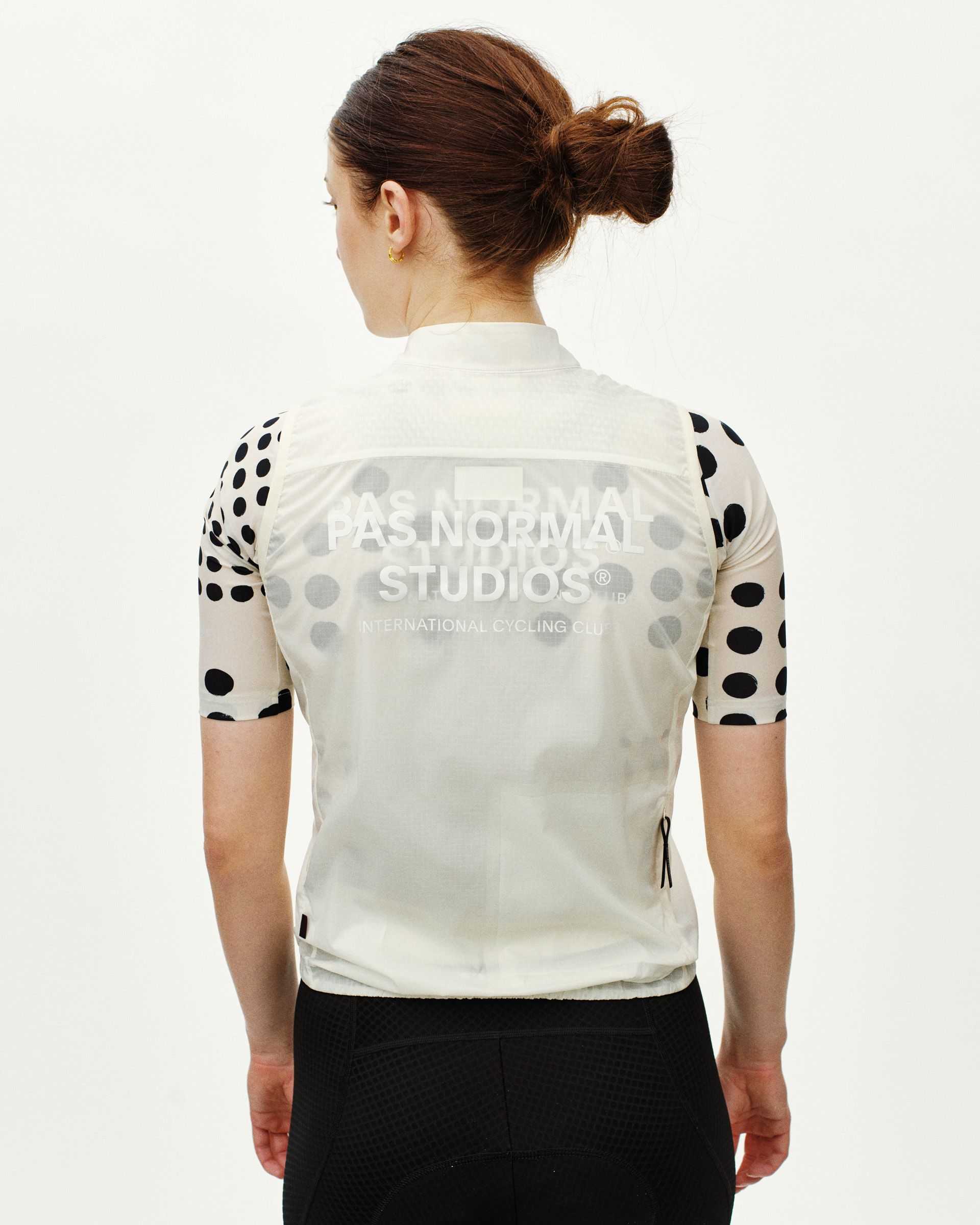 Off White Essential cycling gilet on model, rear view with tonal back print