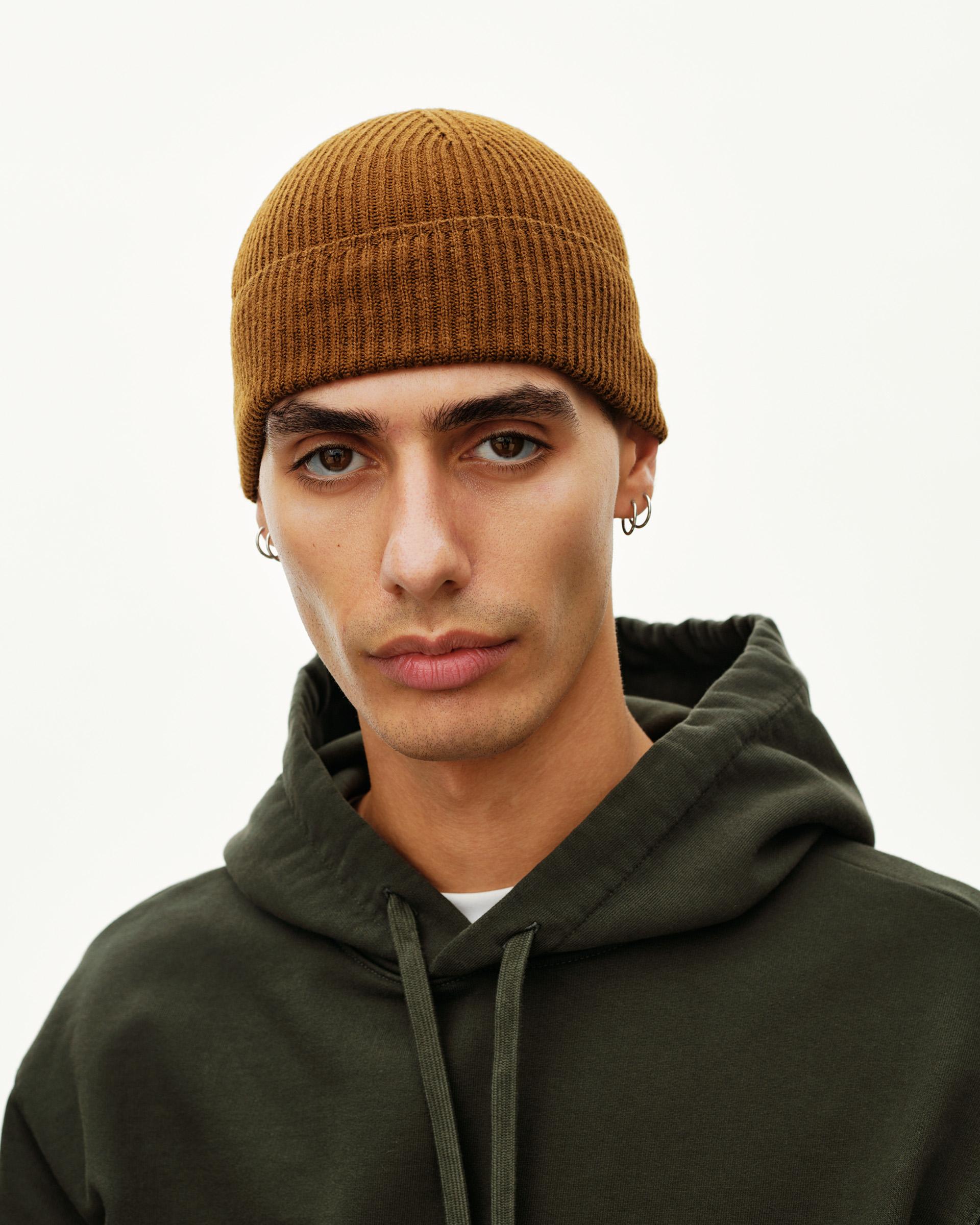 Wood brown Off-Race Merino Knit beanie on model, front view with ribbed knit texture