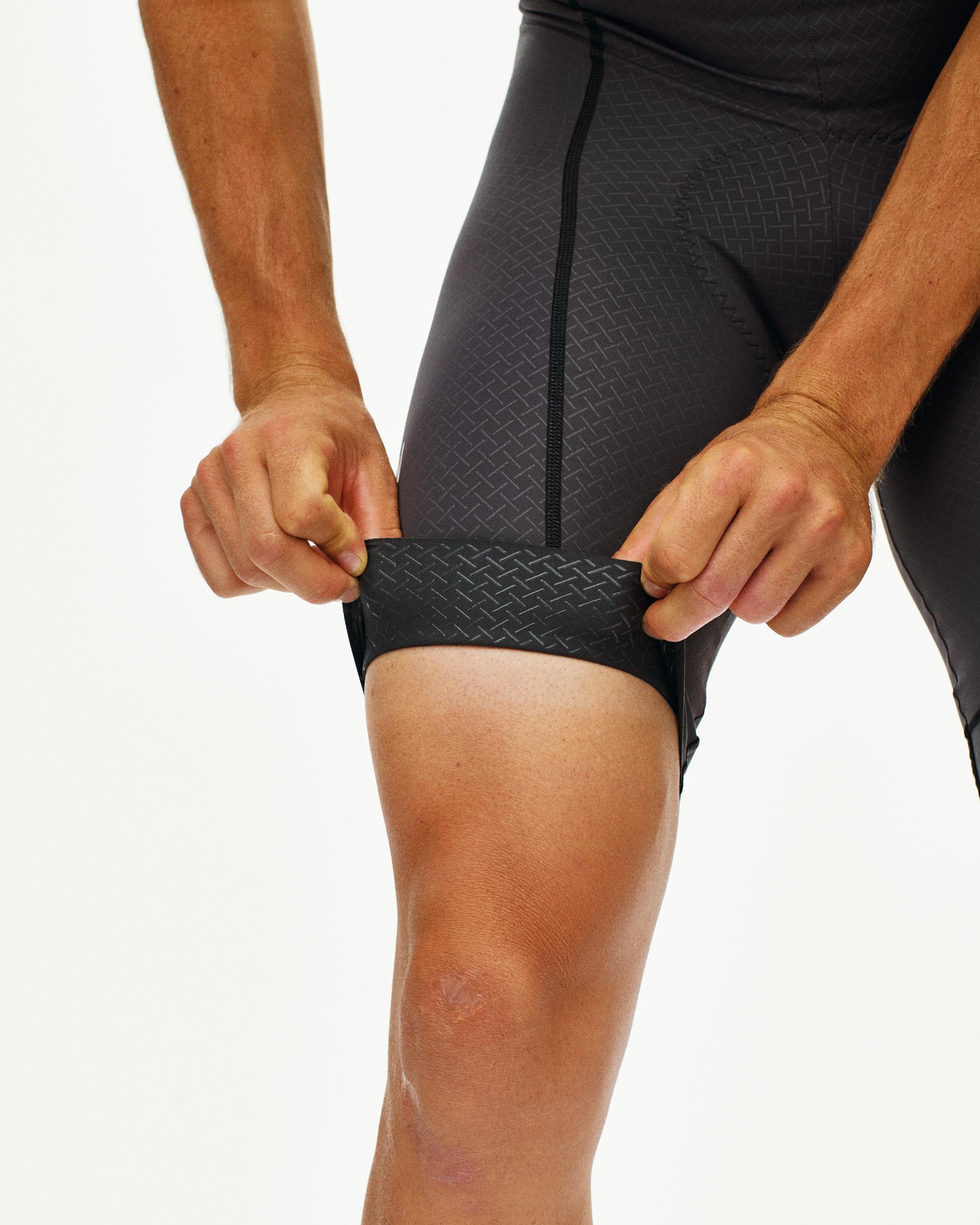 Grey Mechanism cycling bibs on model showing textured leg grippers