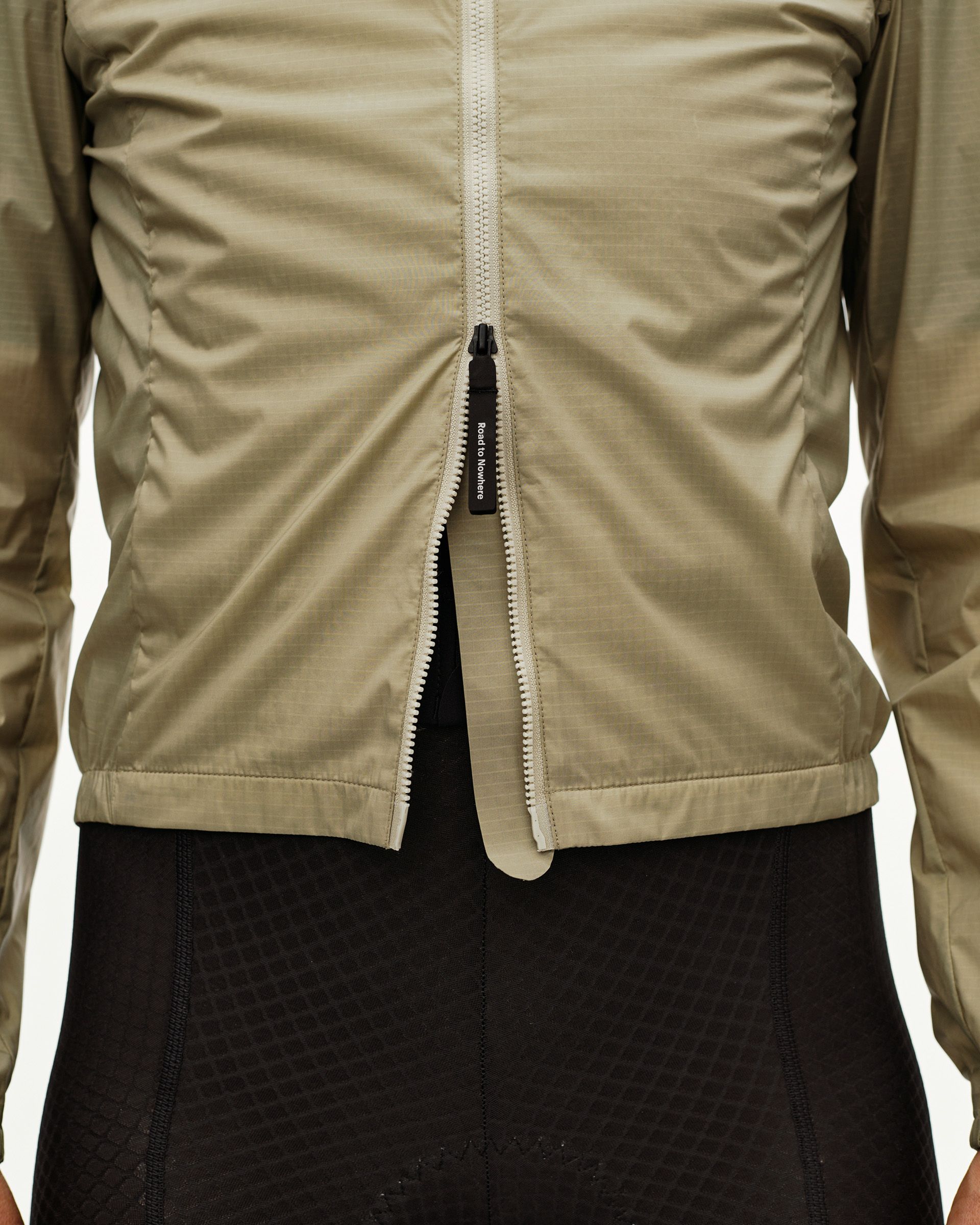 Grey Sage Essential Insulated cycling jacket, front detail on model with open full-length zip