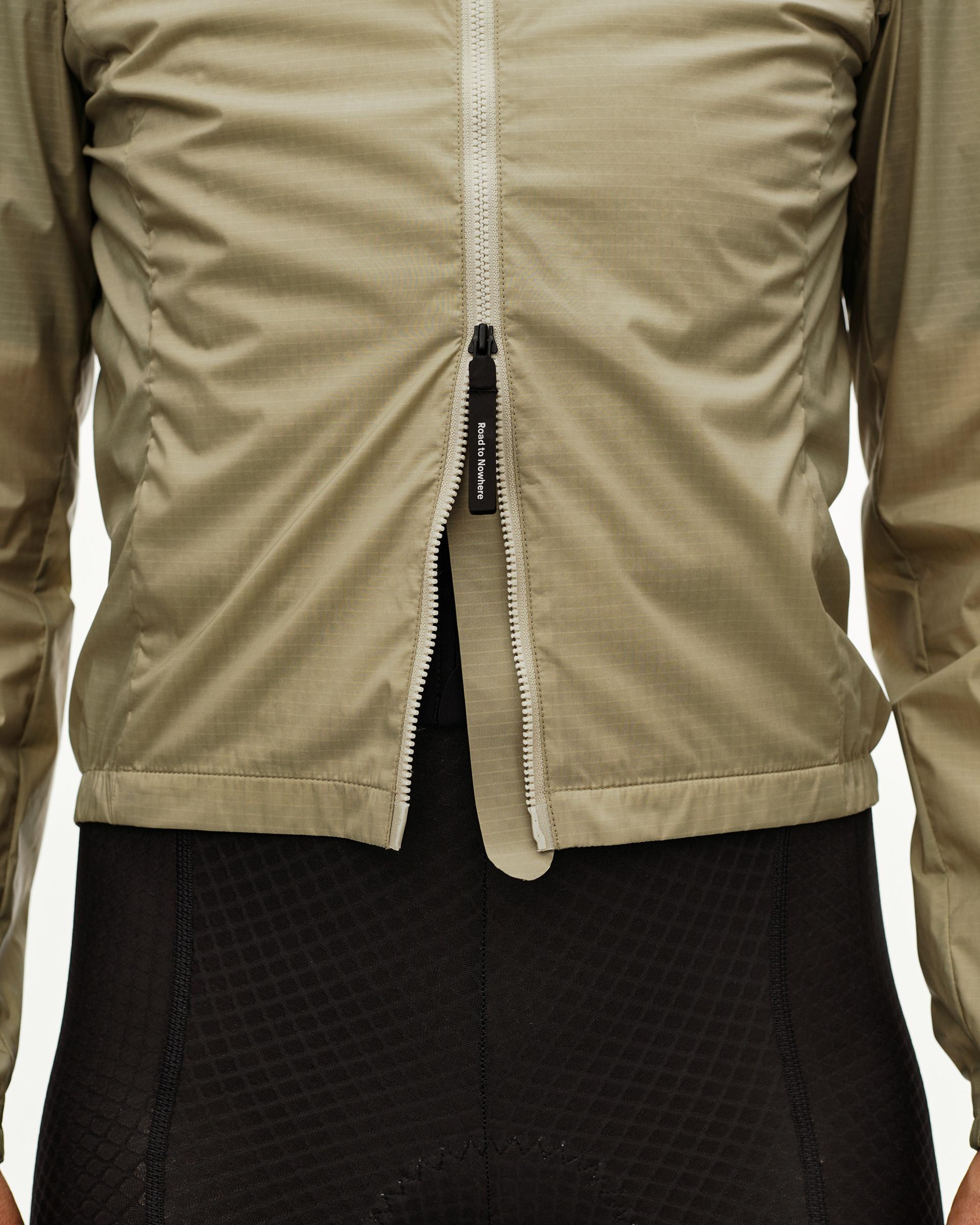 Grey Sage Essential Insulated cycling jacket, front detail on model with open full-length zip
