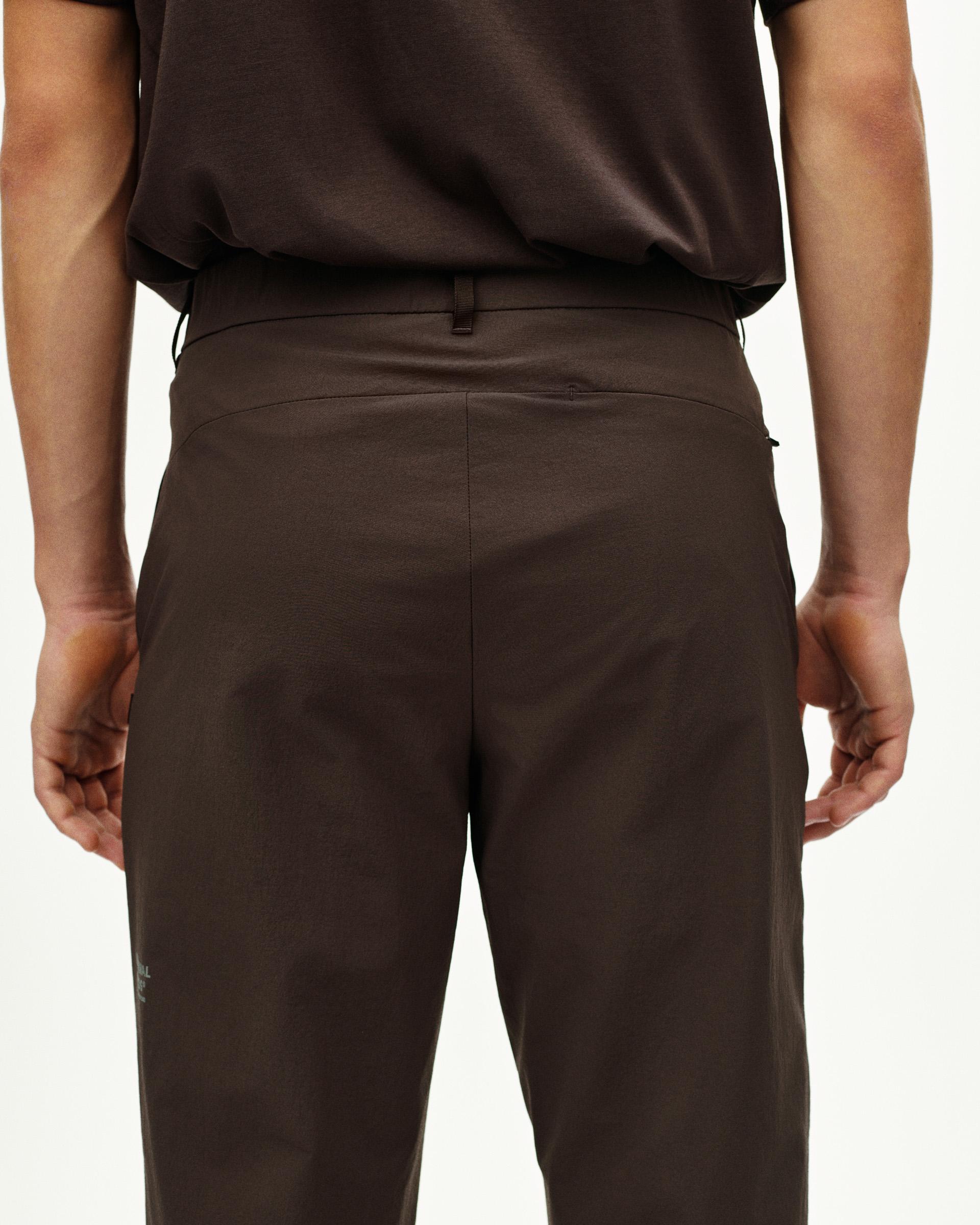 Dark Purple Off-Race Tech pants, rear view on model with tapered fit and back pocket detail