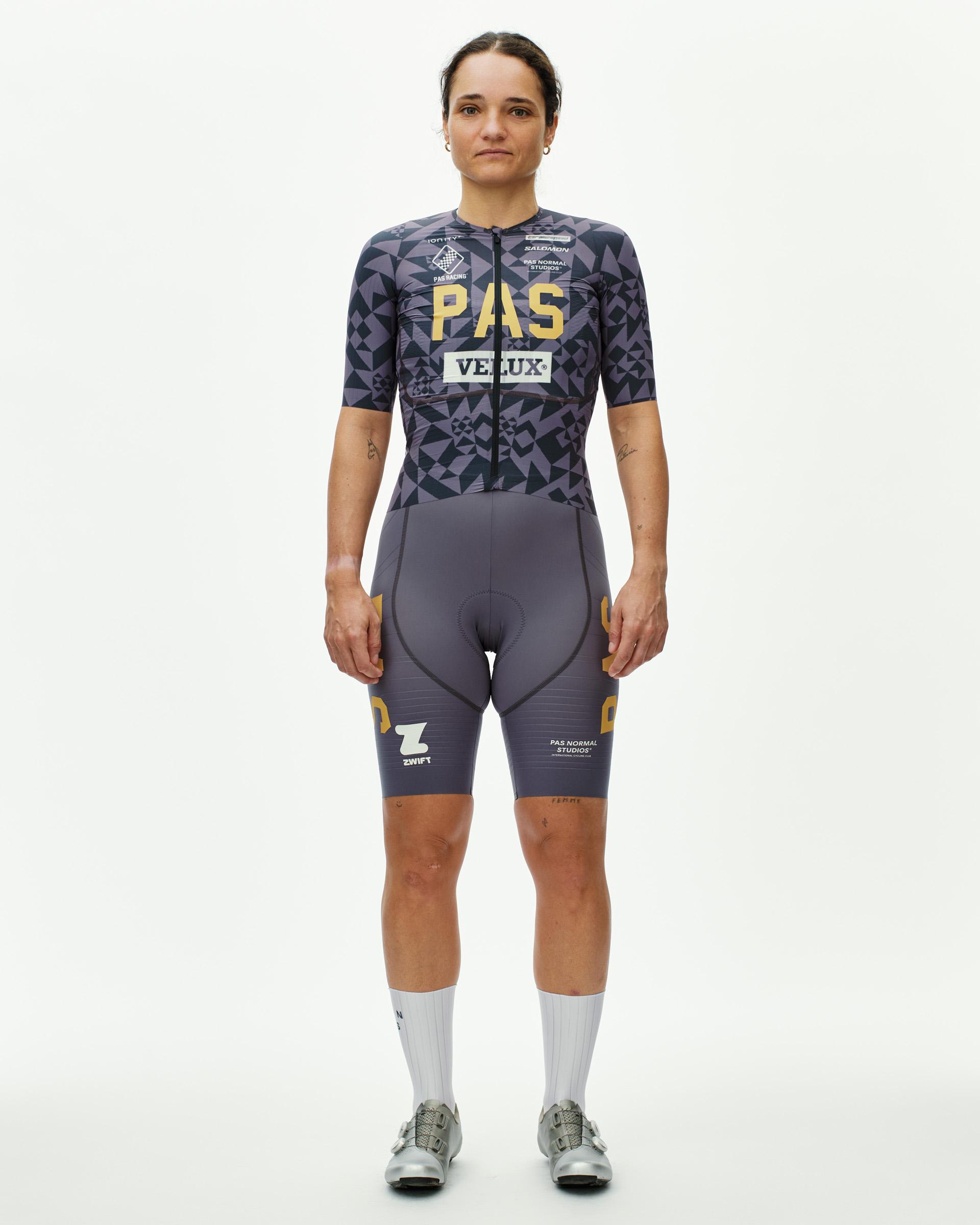 Origami Grey PAS Mechanism Pro women's cycling jersey on model, front view with geometric print and gold chest logo