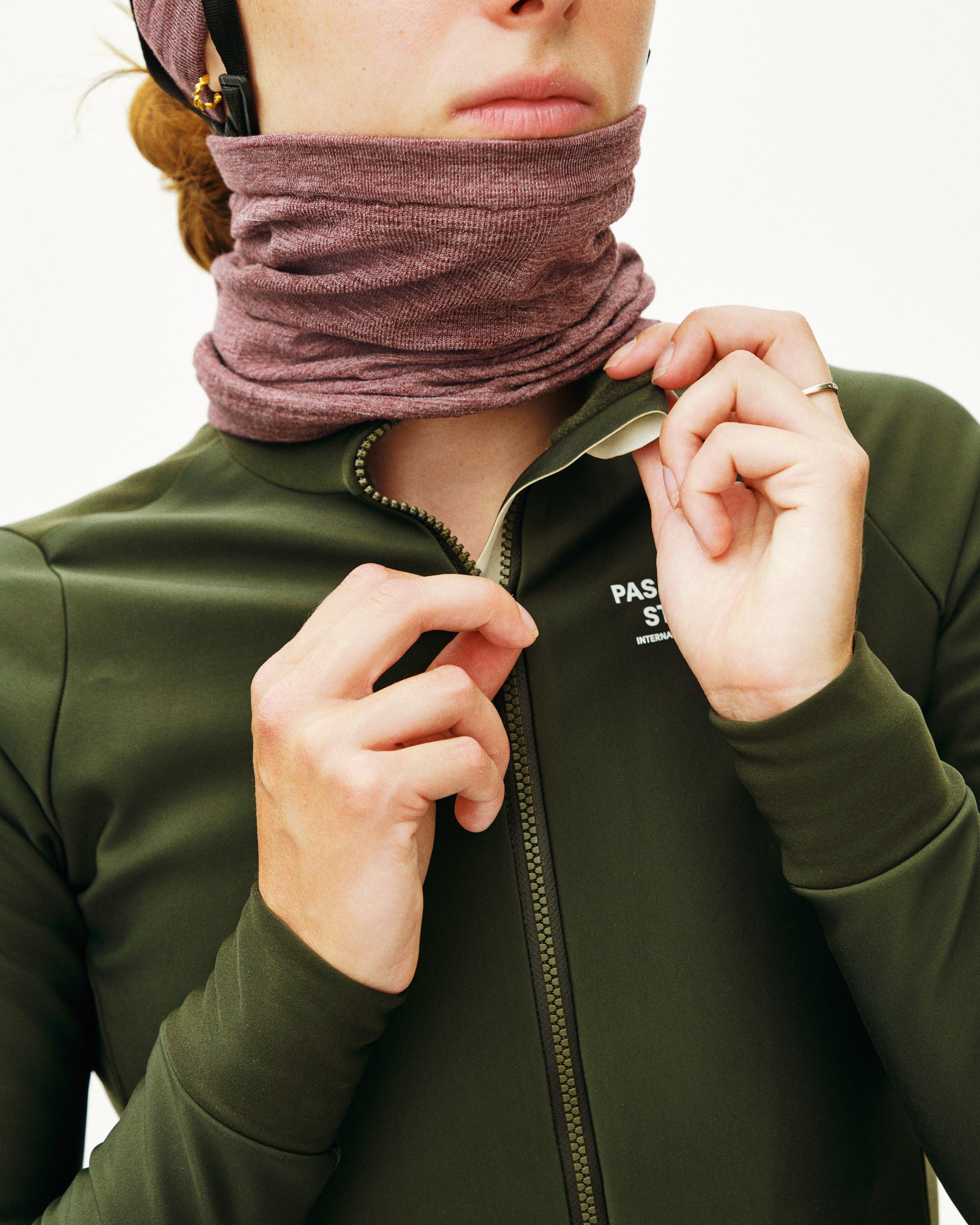 Dark Olive Mechanism Thermal long sleeve cycling jersey on model with full zip and ribbed neck warmer