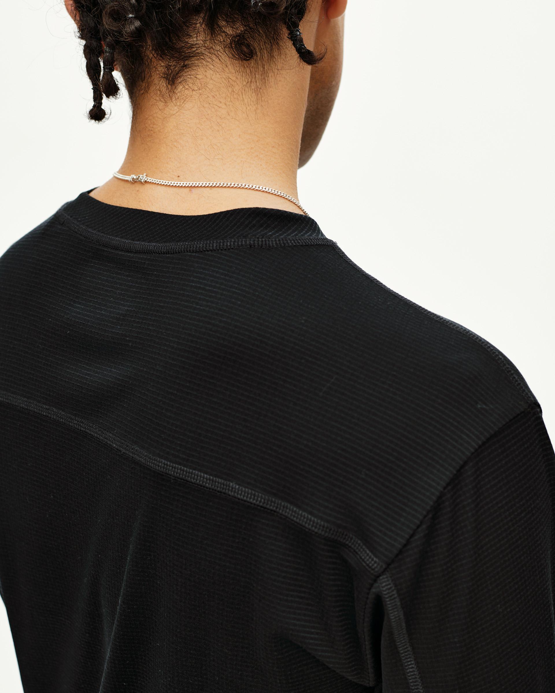 Black Balance long sleeve T-shirt, rear detail on model with ribbed texture and shoulder seam