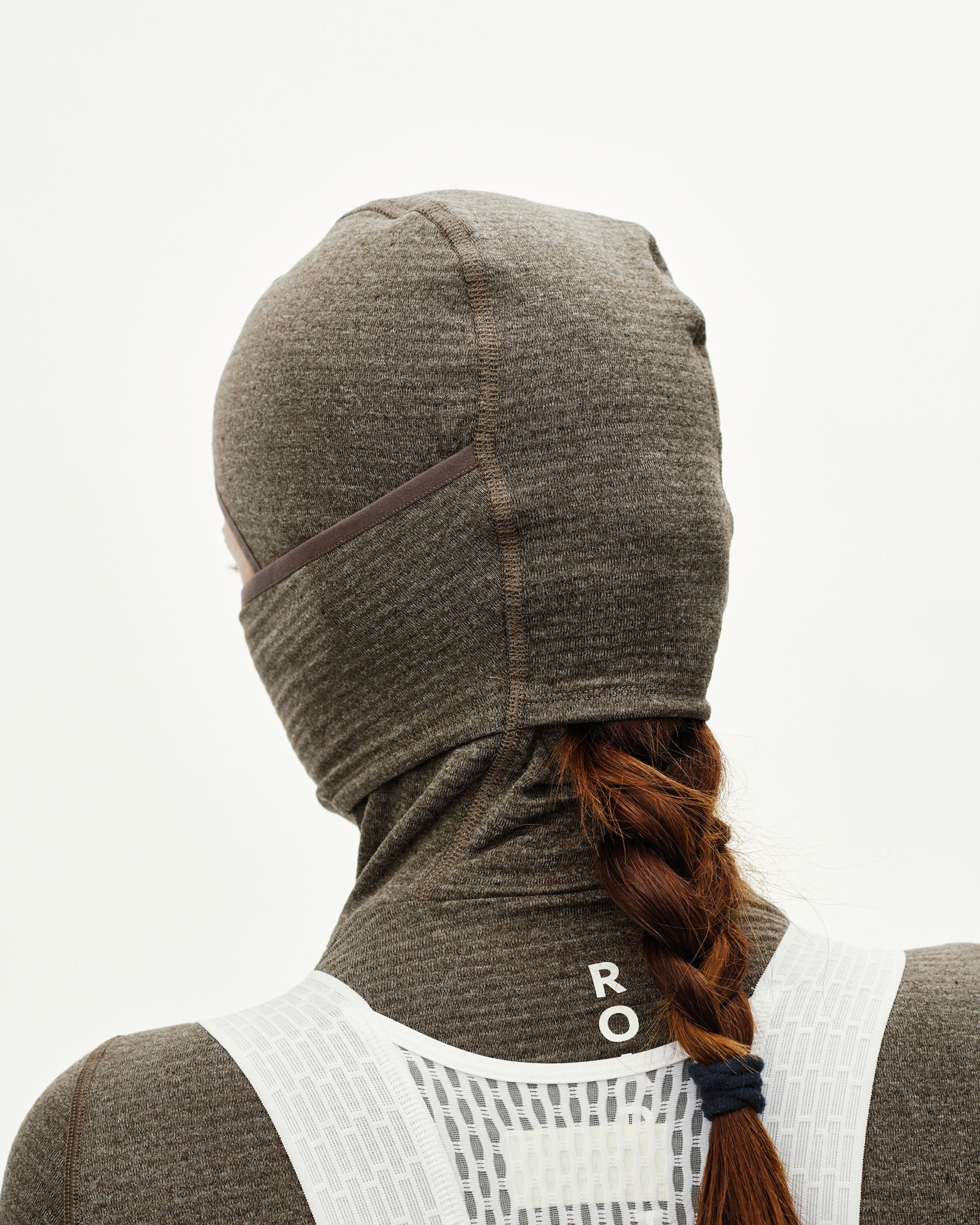 Dark Coffee brown cycling balaclava on model, rear view with center seam and neck coverage