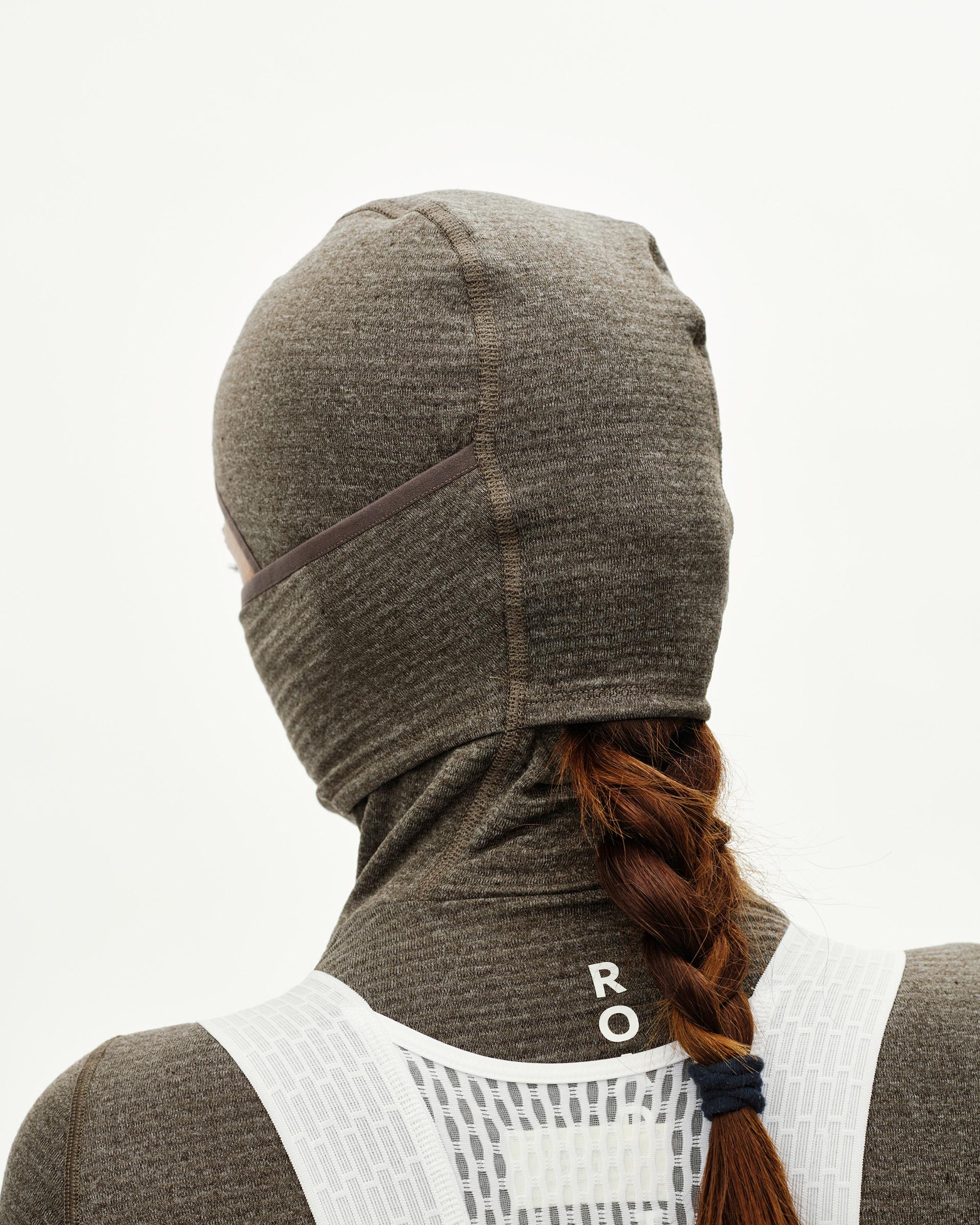 Dark Coffee brown cycling balaclava on model, rear view with center seam and neck coverage