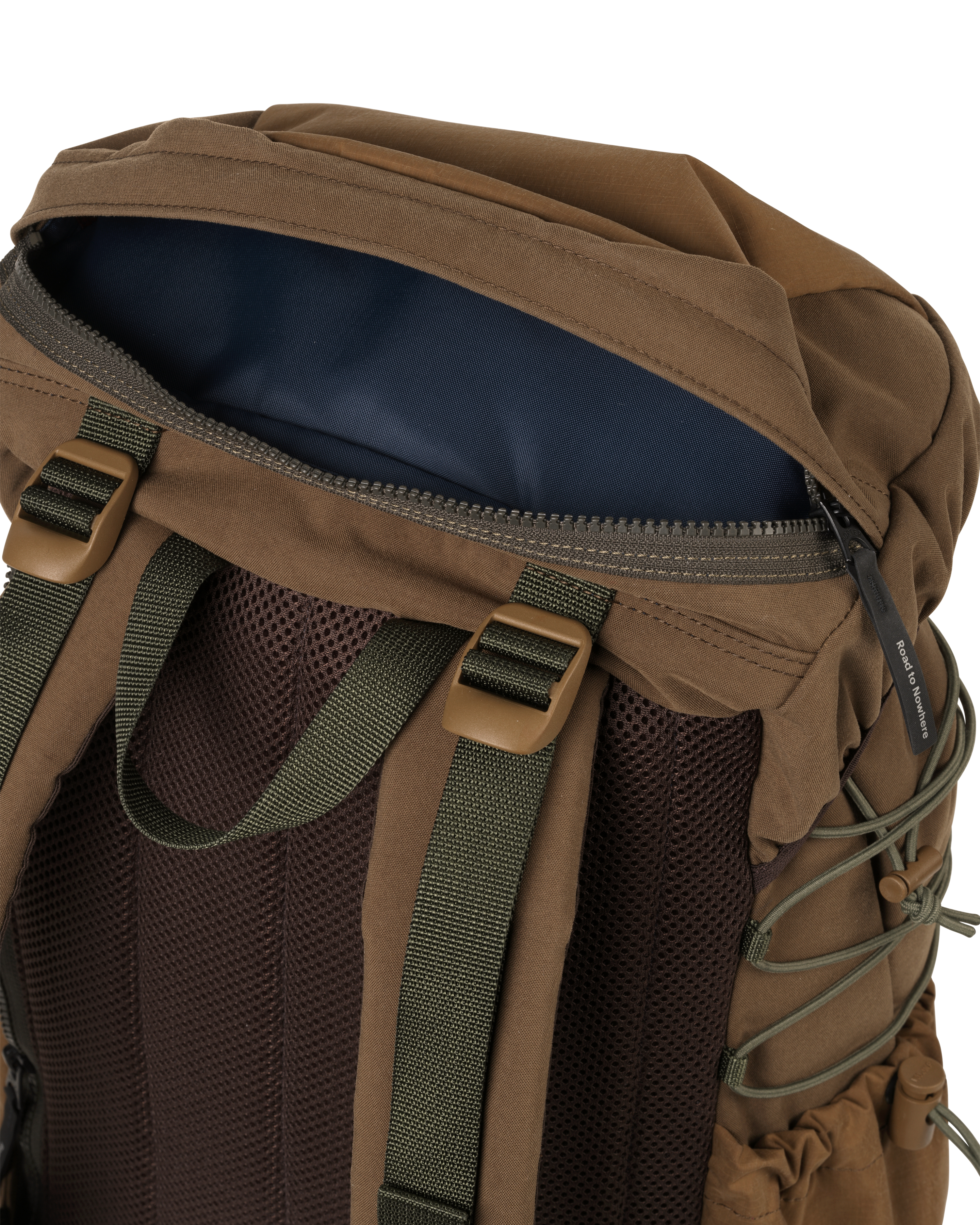 Light Brown Porter-Yoshida backpack, detail view of open top zip pocket with navy lining and olive shoulder straps