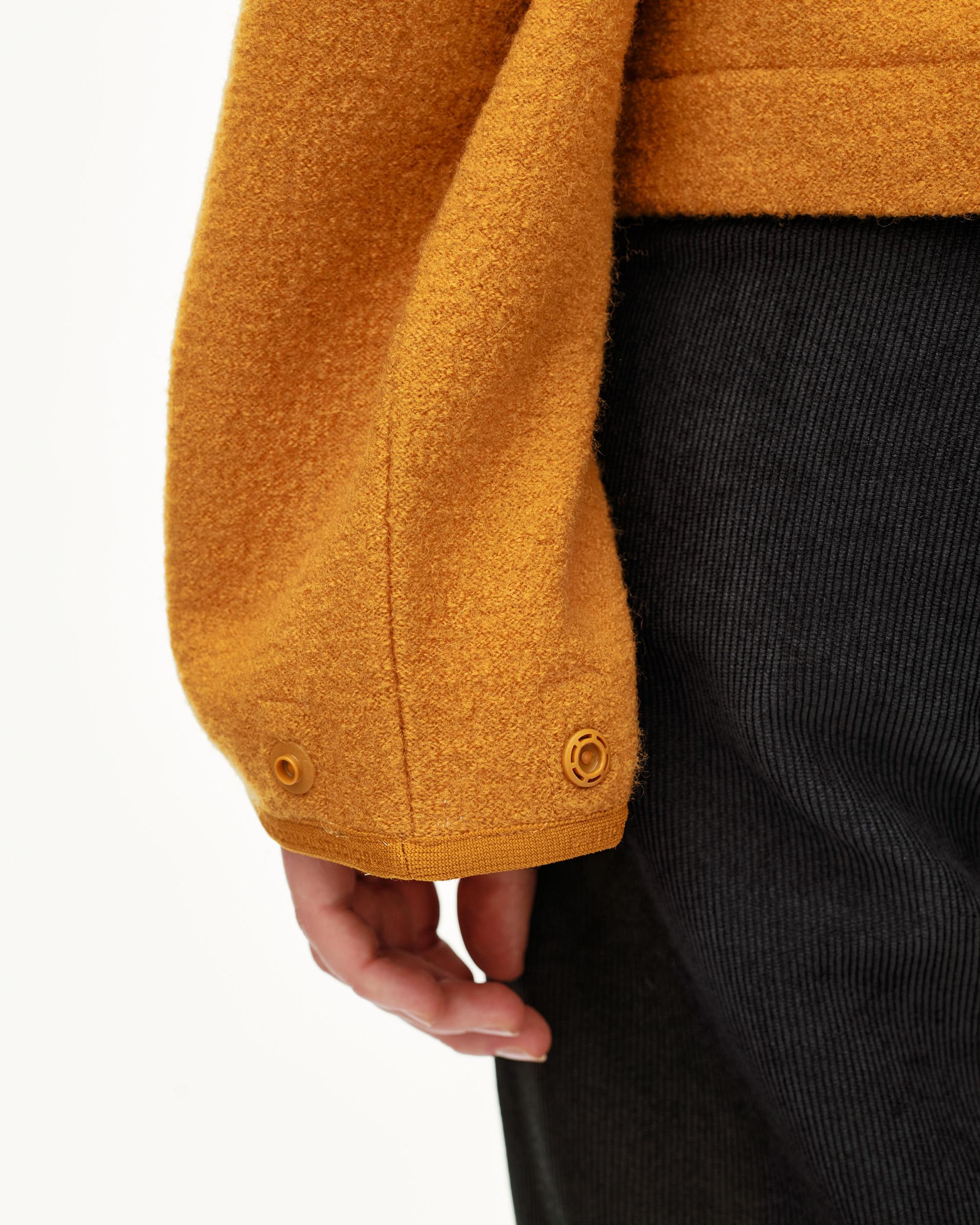 Ochre Off-Race Boiled Wool jacket, sleeve detail on model with tonal snap buttons at cuff