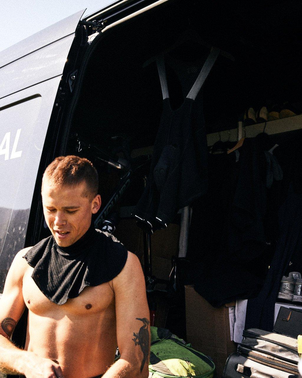 Model changing in vehicle doorway with cycling gear