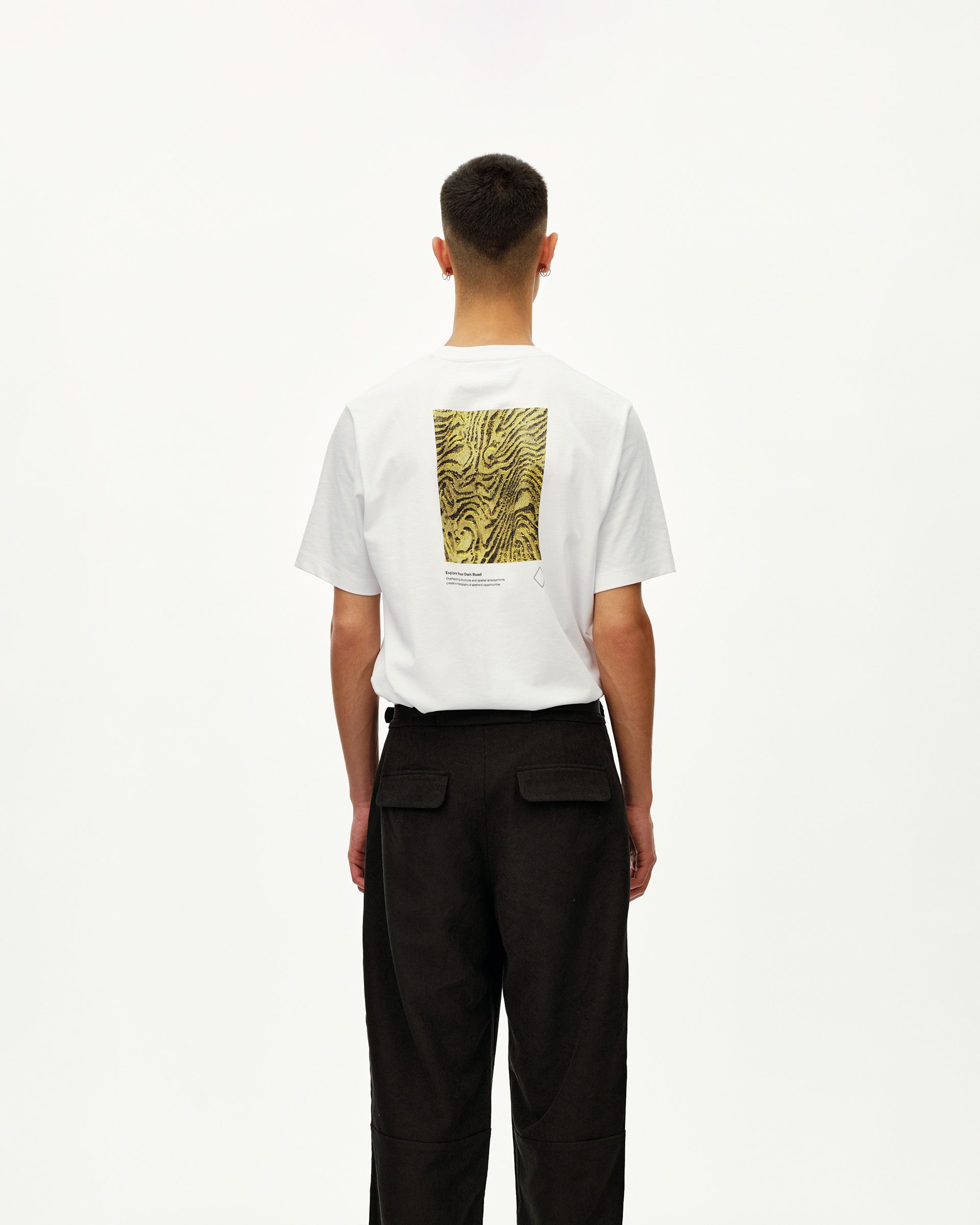 Black Off-Race Corduroy pants, rear view on model with patch pockets