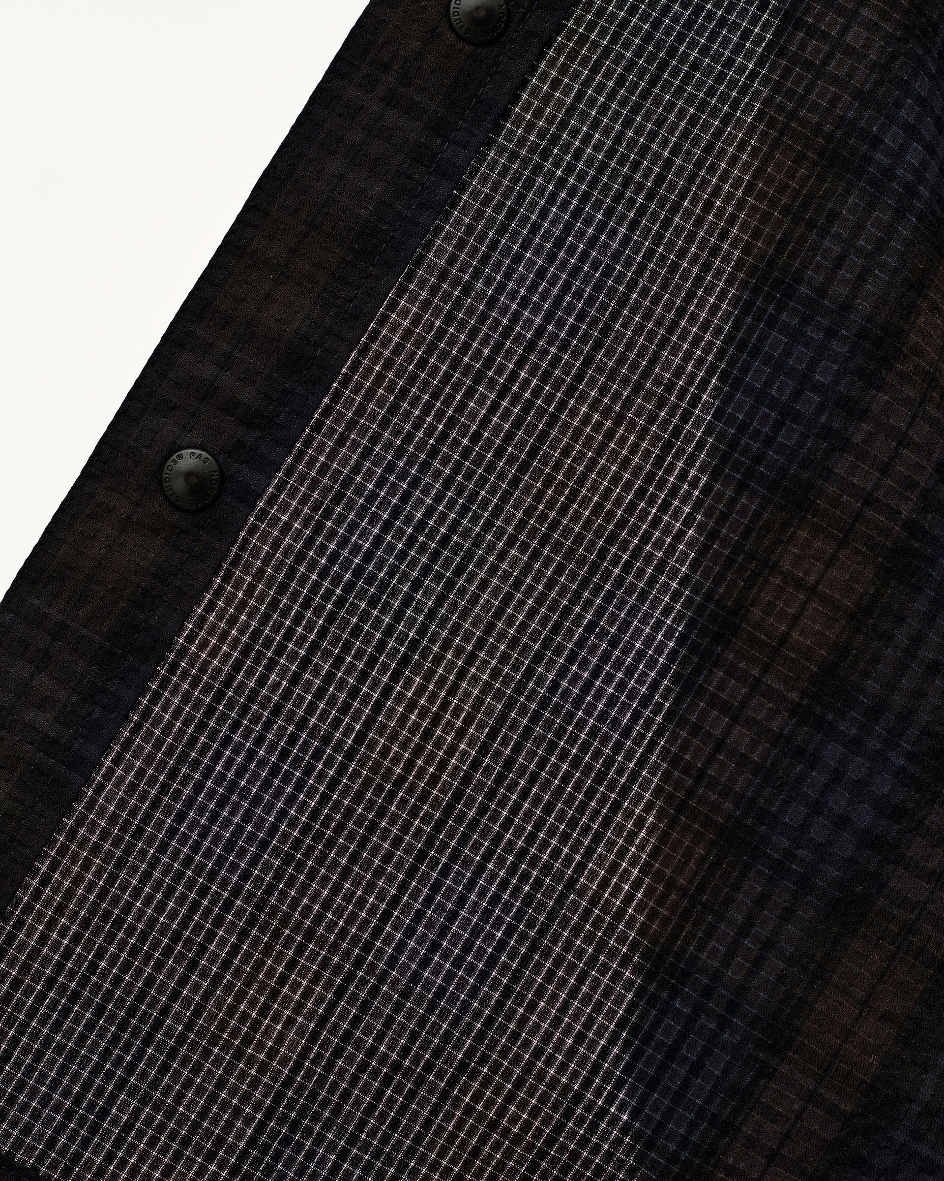 Dark Navy Off-Race Seersucker Shirt, detail view of grid-texture fabric with branded snap buttons