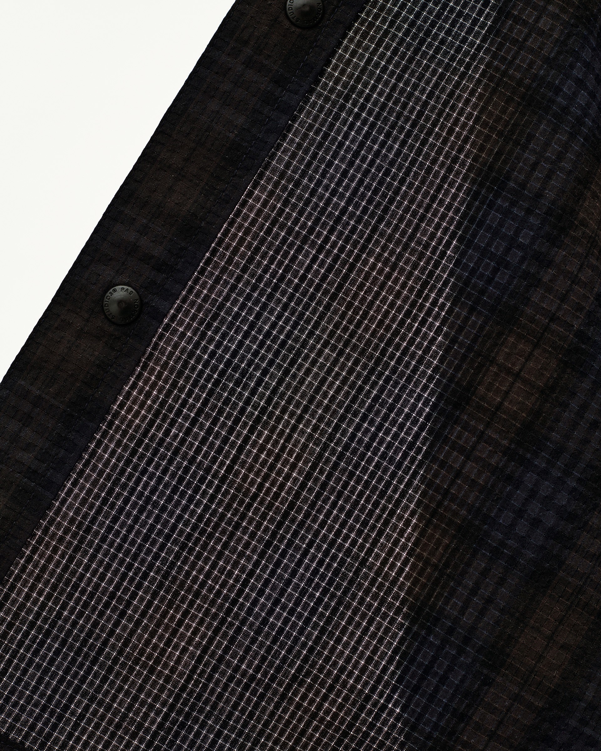 Dark Navy Off-Race Seersucker Shirt, detail view of grid-texture fabric with branded snap buttons