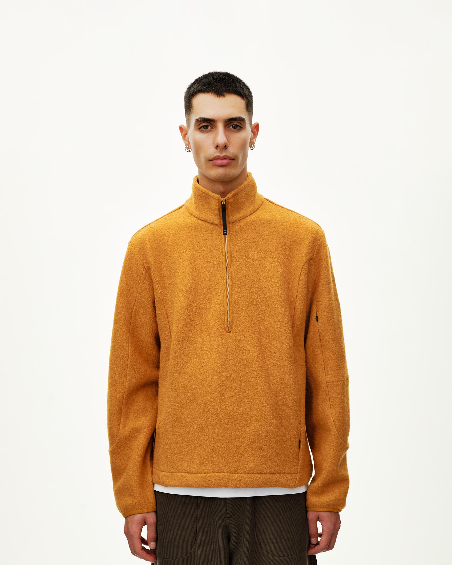 Ochre Off-Race Boiled Wool Half-Zip outerwear on model, front view with gold half-zip and stand collar