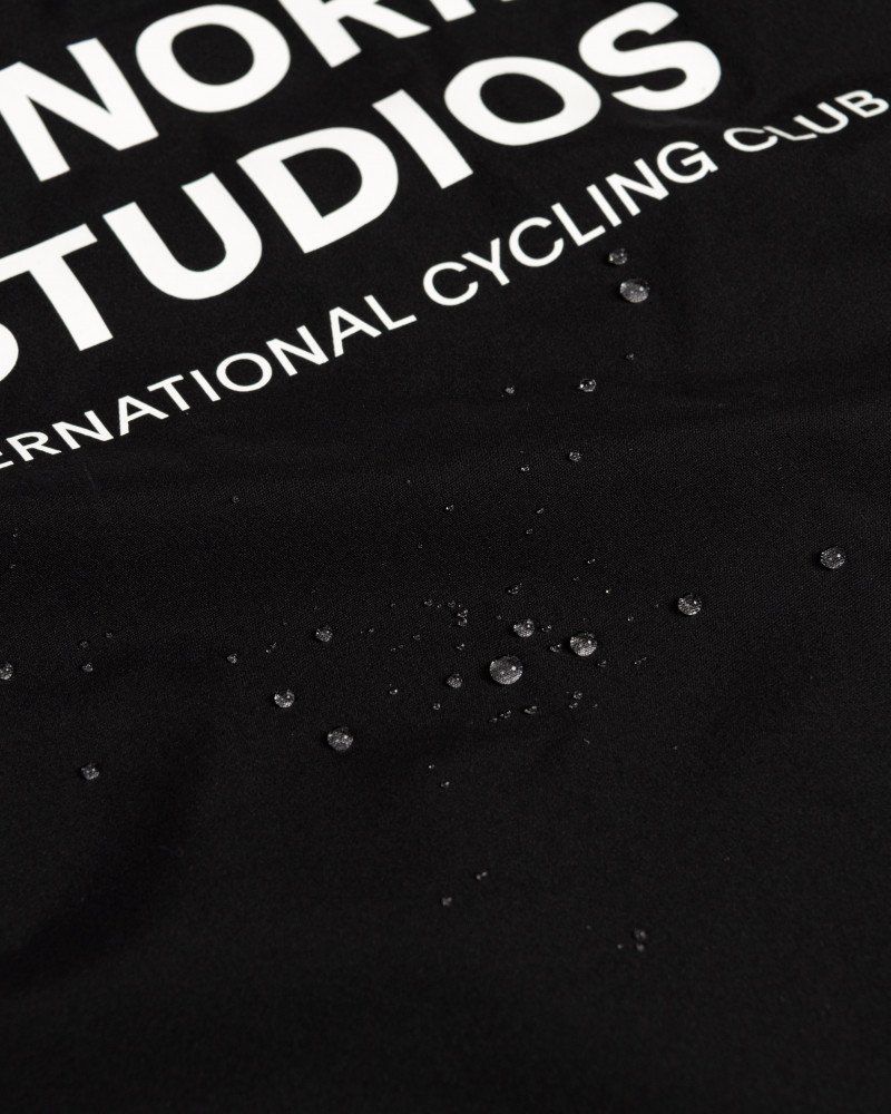 Navy Mechanism Stow Away gilet, detail view with water droplets on fabric surface