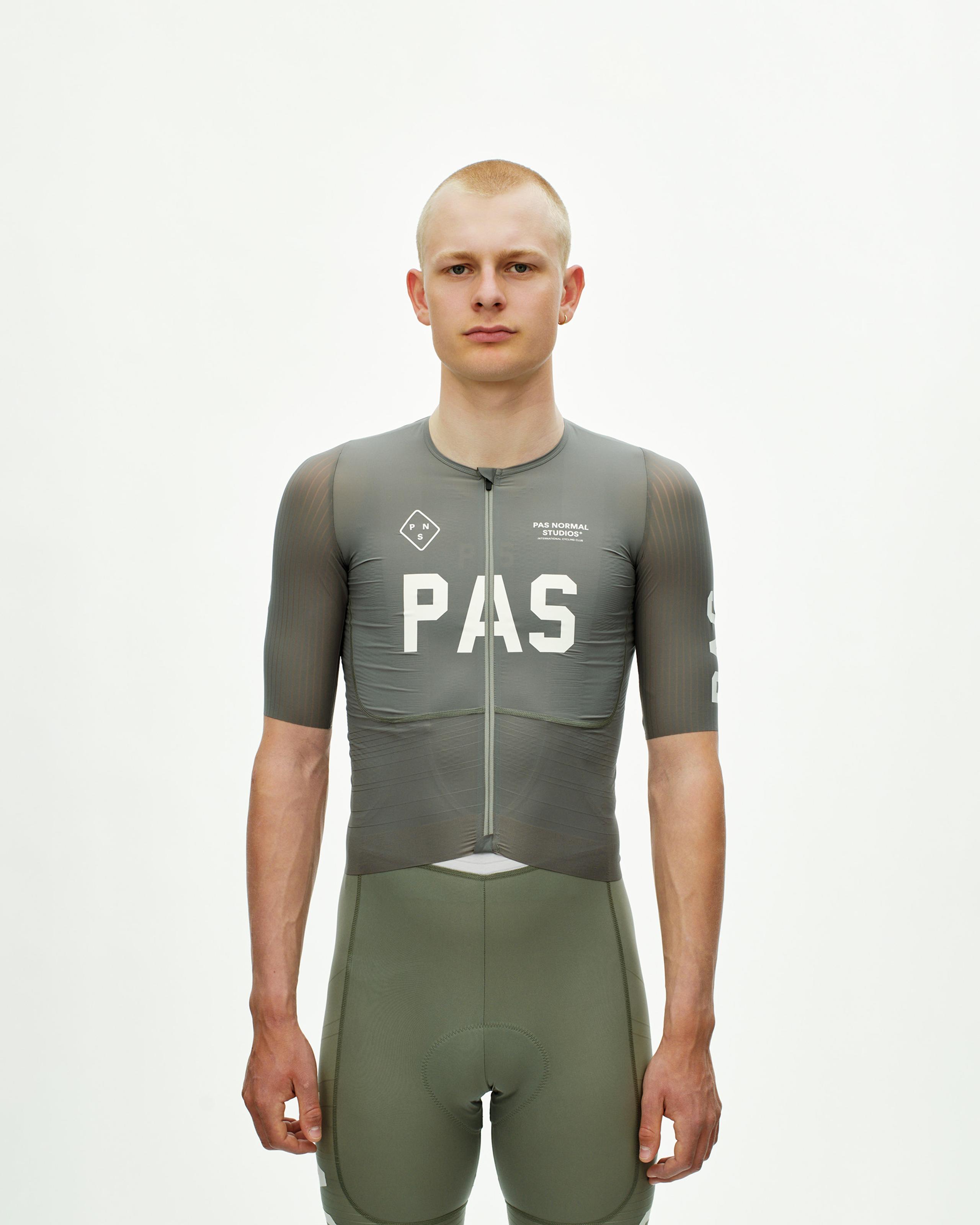 Grey PAS Mechanism Pro cycling jersey on model with white chest logo