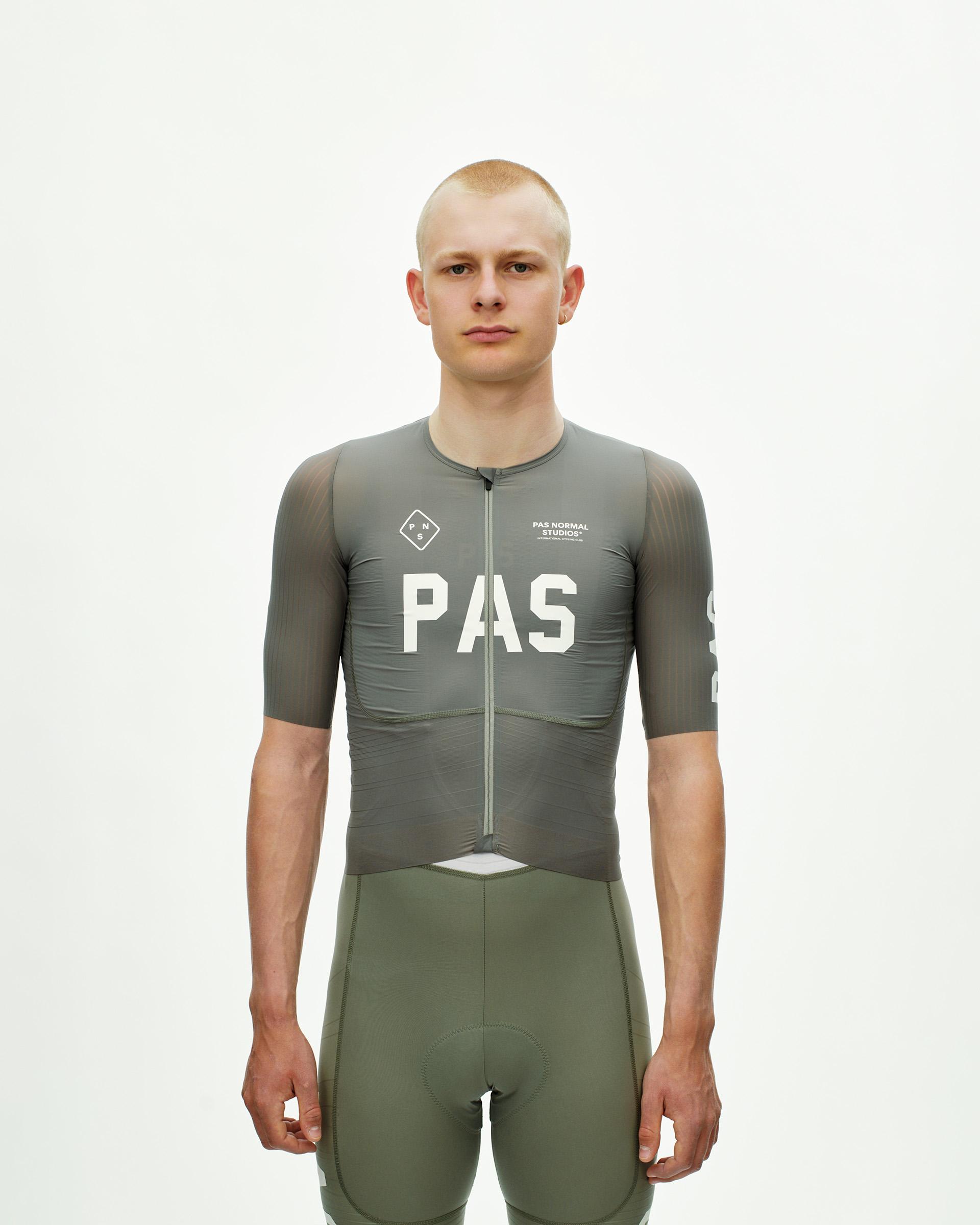 Grey PAS Mechanism Pro cycling jersey on model with white chest logo