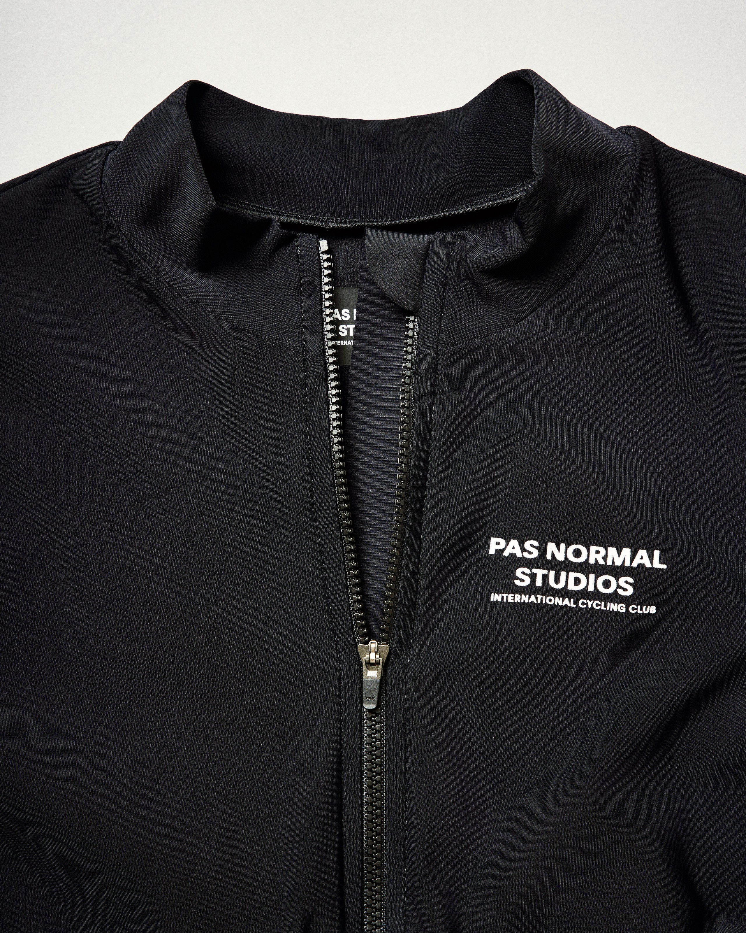 Black jersey with full-length zipper and soft fleece lining for moisture management and comfort
