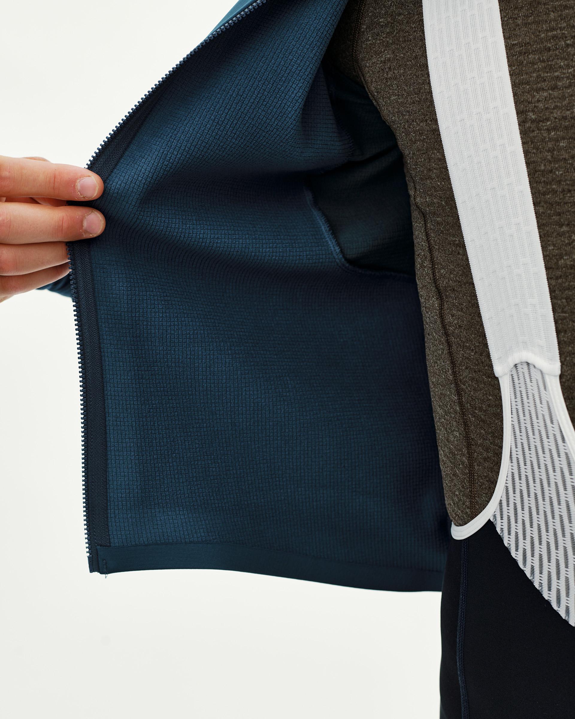 Denim Blue Mechanism Thermal Long Sleeve cycling jersey, interior detail on model showing textured inner lining