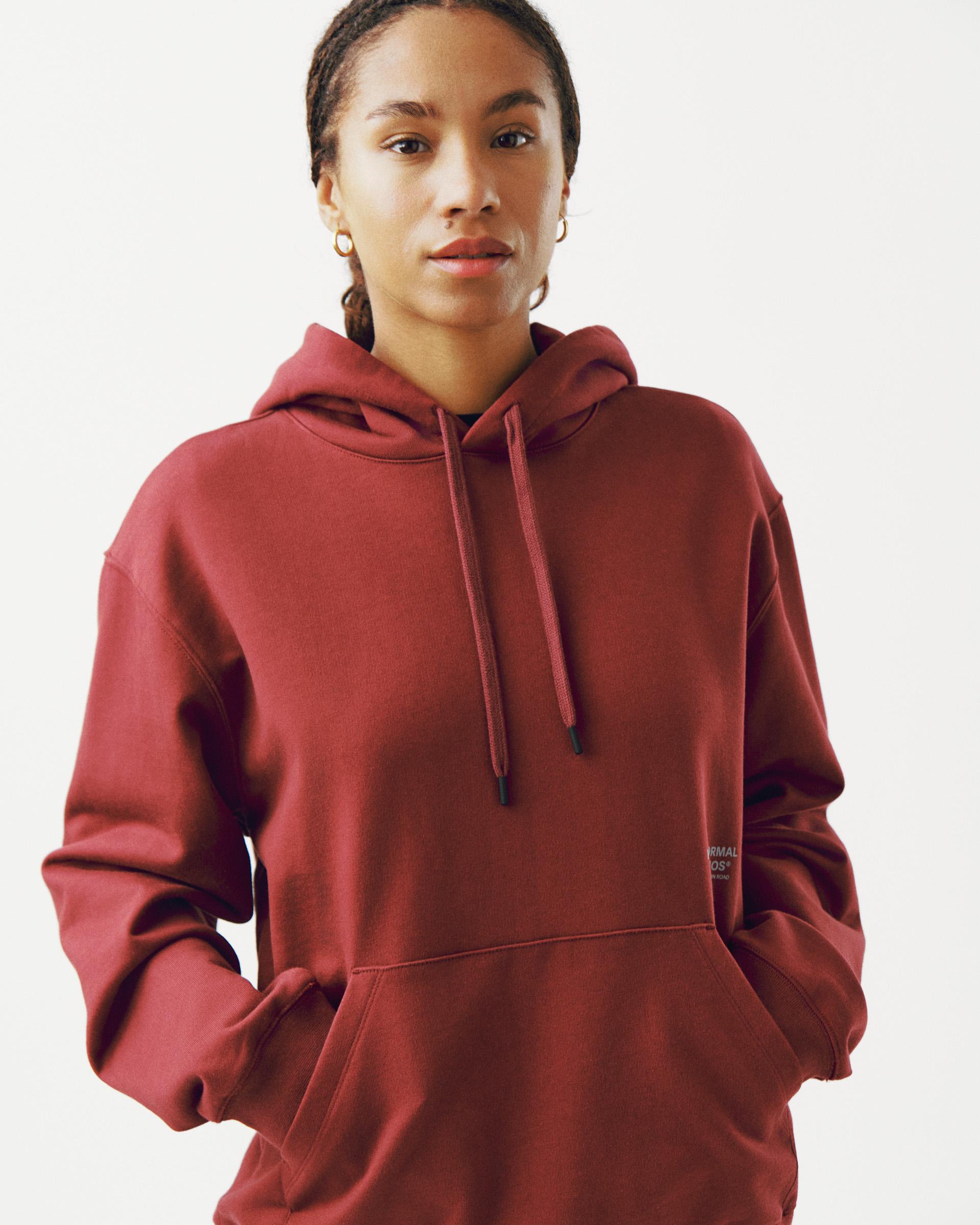Maroon Off-Race Graphic hoodie on model with front kangaroo pocket