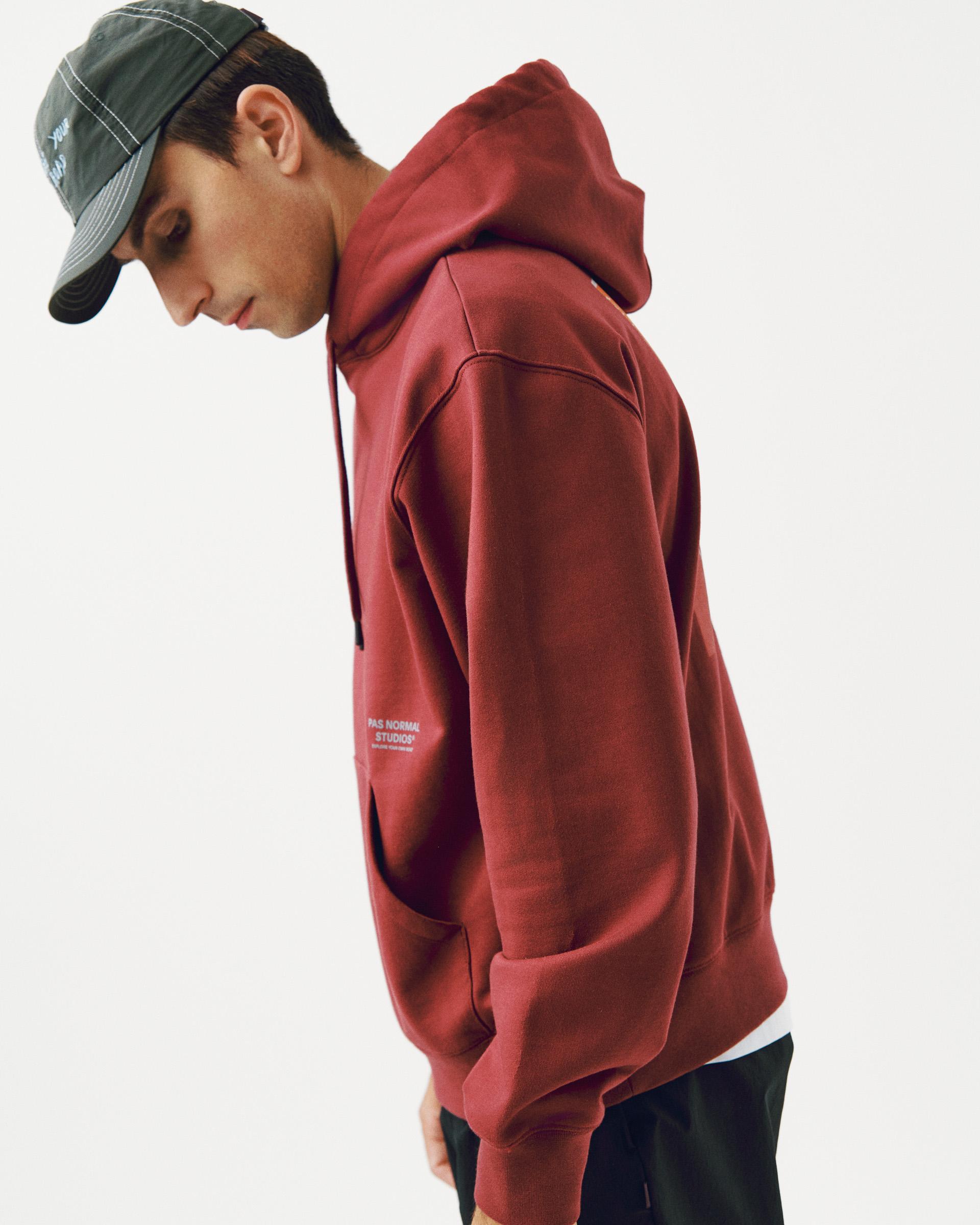 Maroon Off-Race Graphic hoodie on model, side view with white sleeve logo