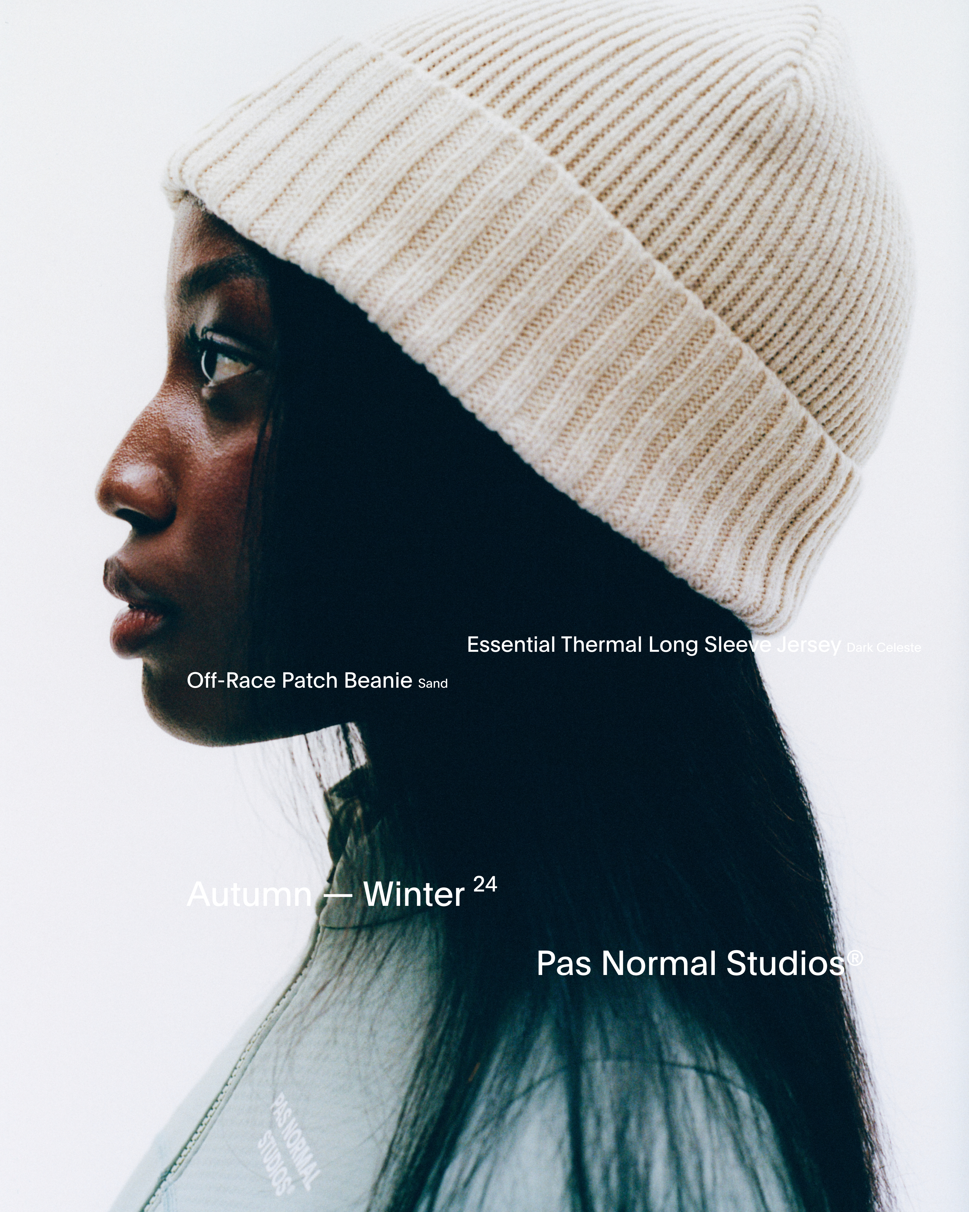 Model wearing Off-Race Patch Beanie in sand ribbed knit with Essential Thermal Long Sleeve jersey