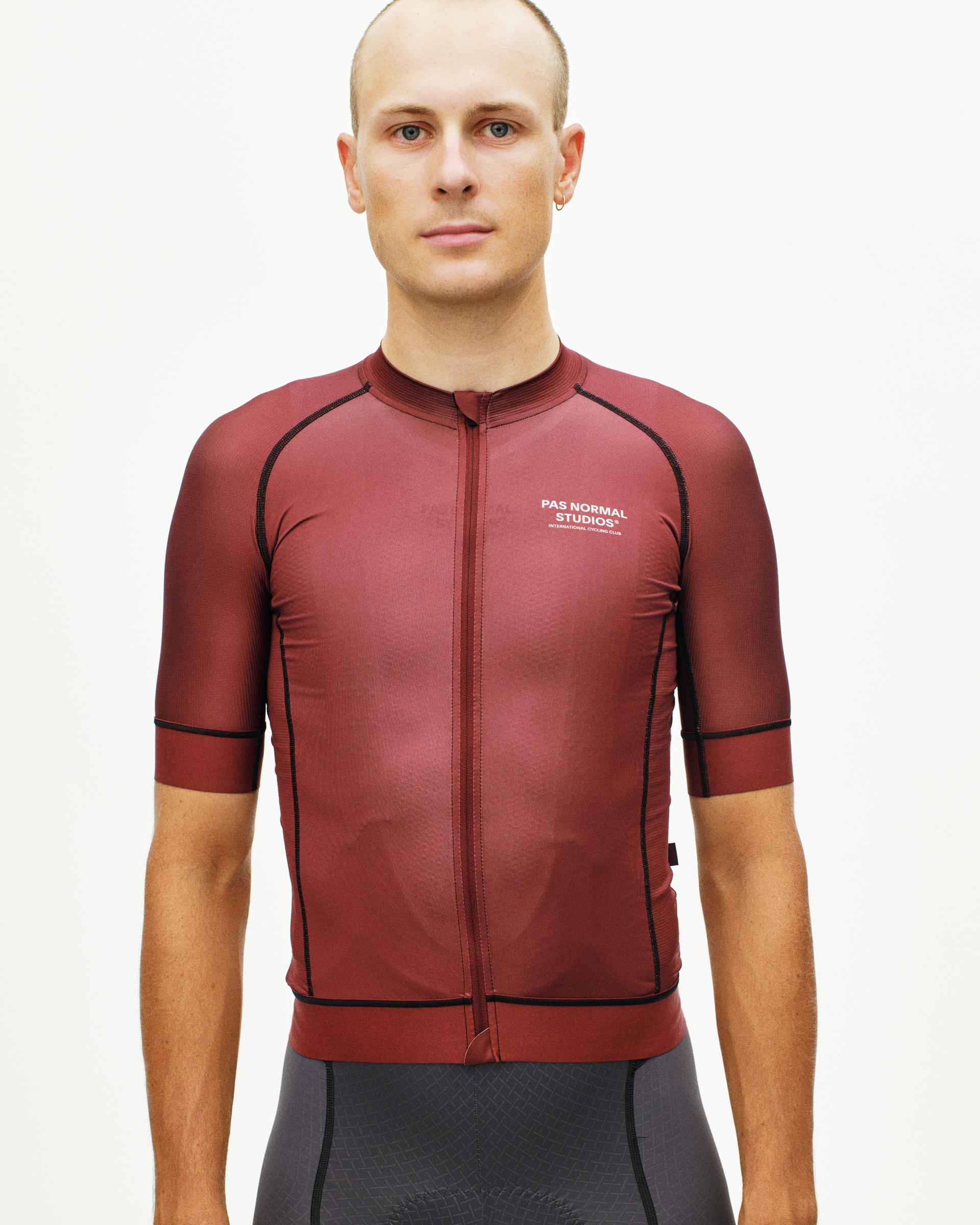Maroon Mechanism cycling jersey on model with black contrast seaming