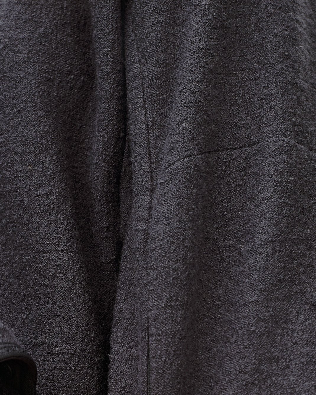 Dark Grey Off-Race Boiled Wool jacket, detail view of textured fabric and side seam