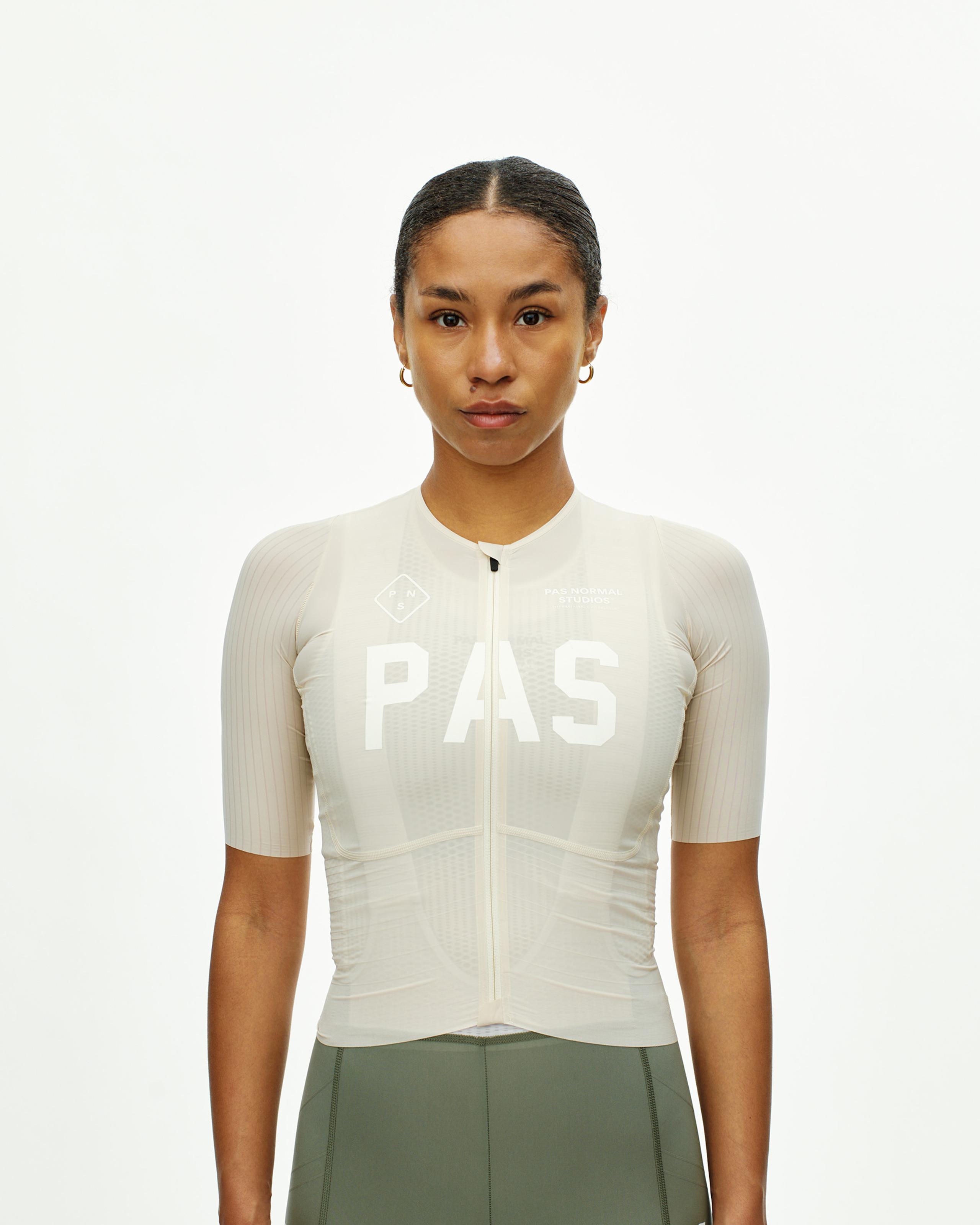 Cream PAS Mechanism Pro cycling jersey on model with white chest print