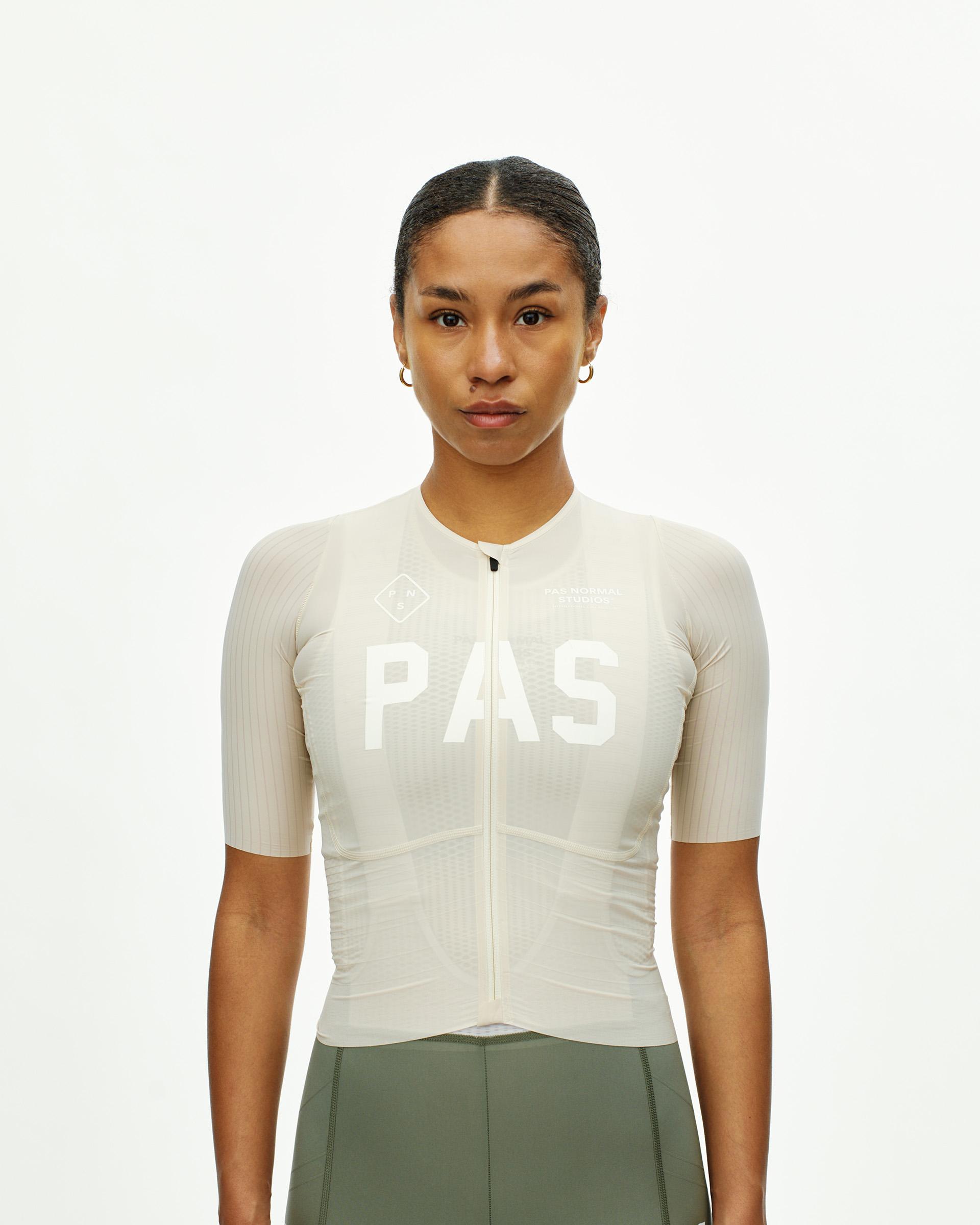 Cream PAS Mechanism Pro cycling jersey on model with white chest print