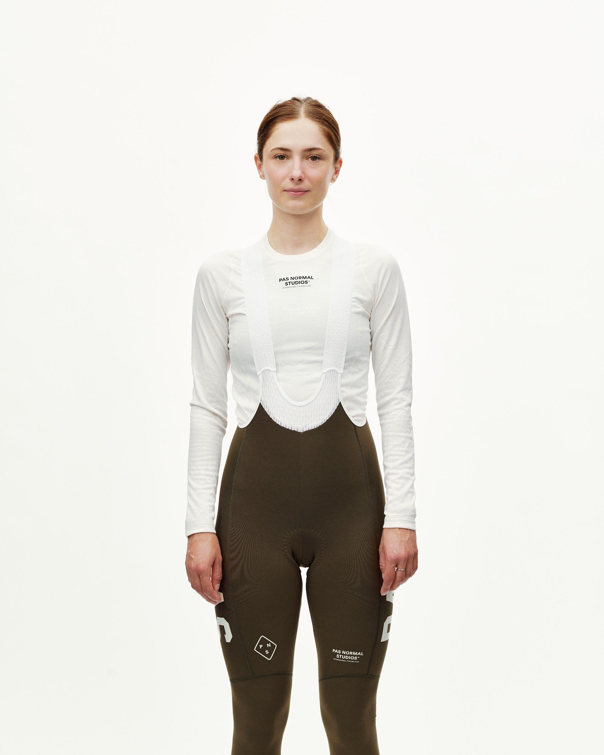 Dusty Earth khaki PAS Mechanism women's thermal long cycling bibs, front view on model with white bib straps