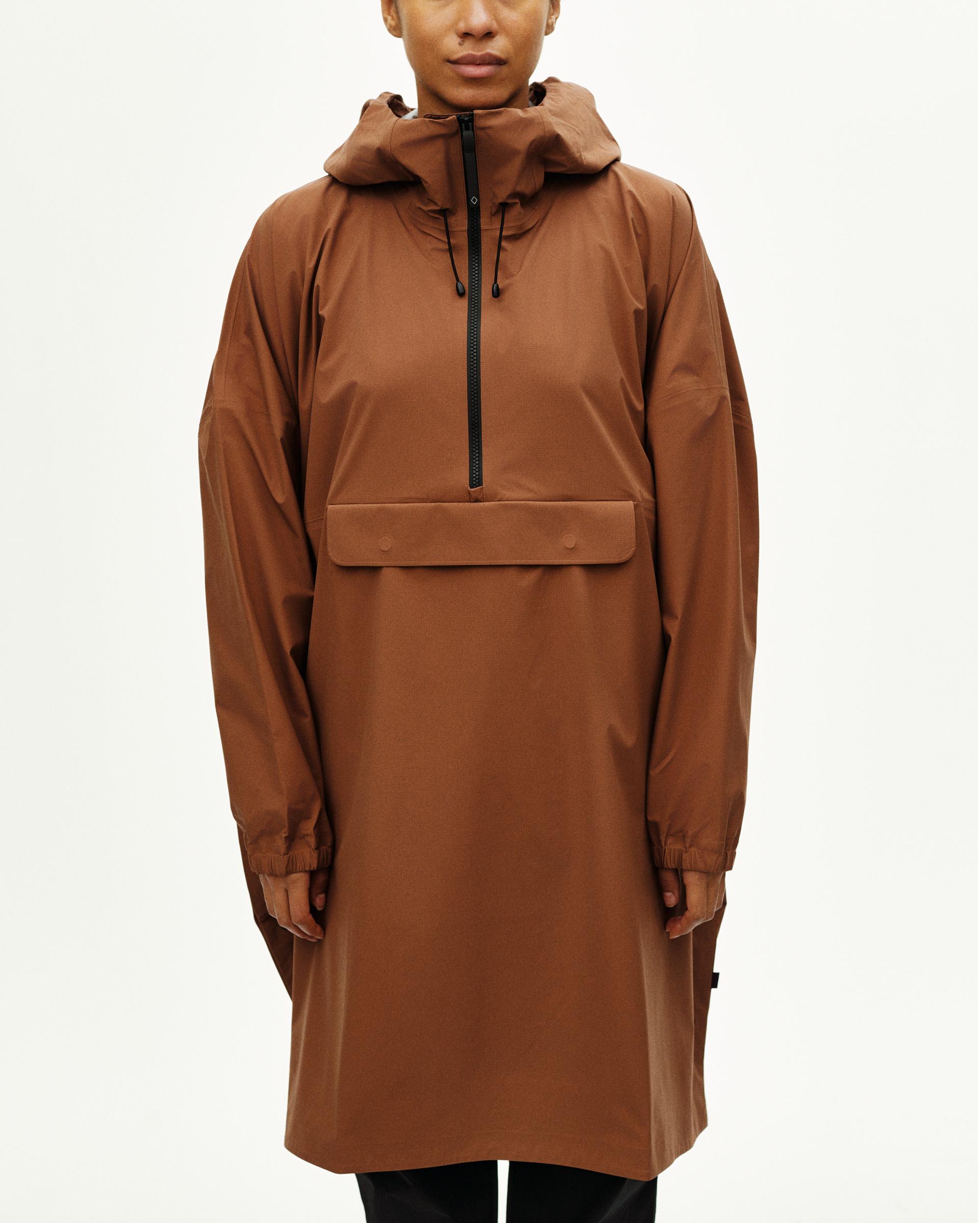 Brown Off-Race 3L Poncho on model with hood and half-zip front pocket