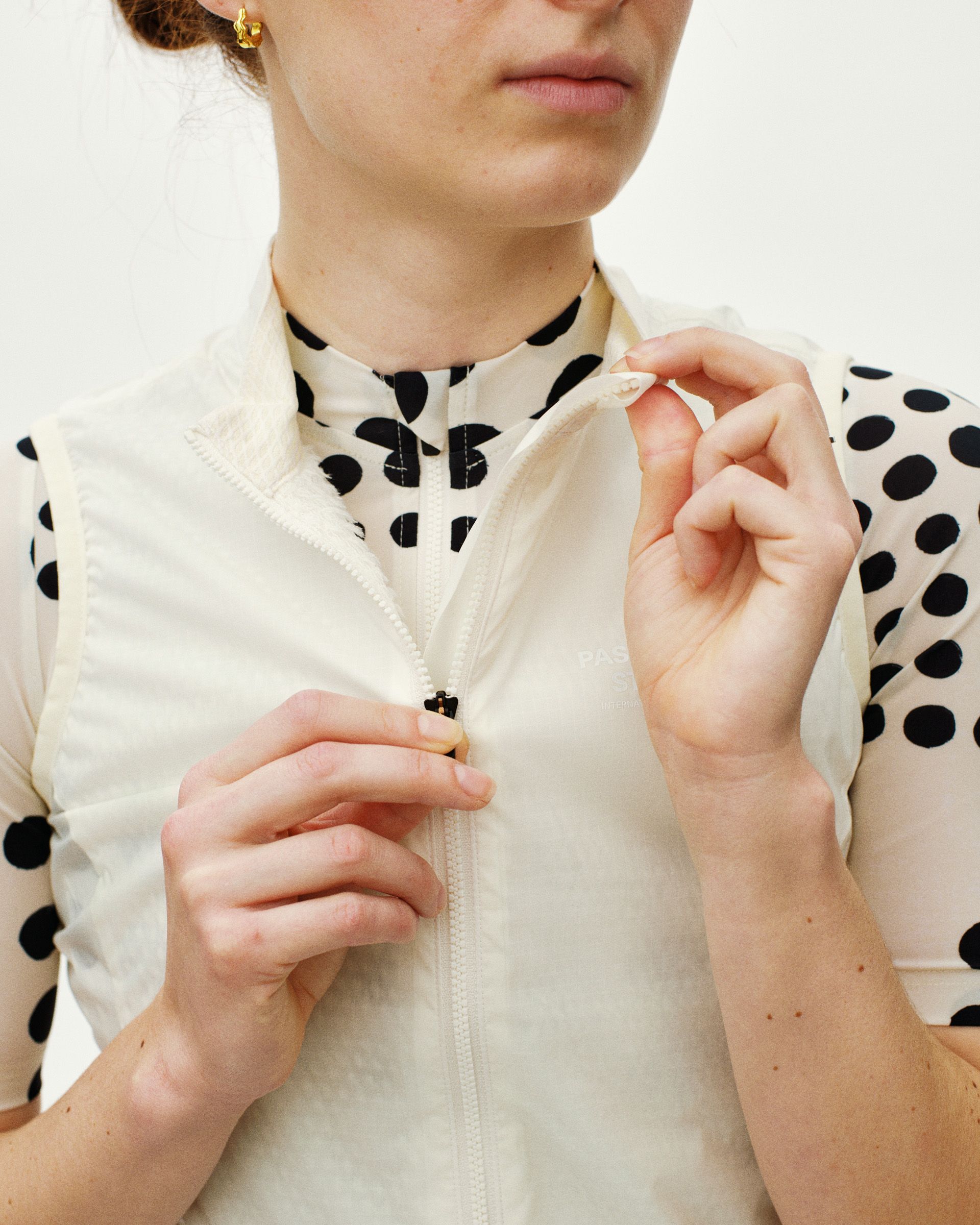 Off White Essential cycling gilet on model, front detail view with zip closure