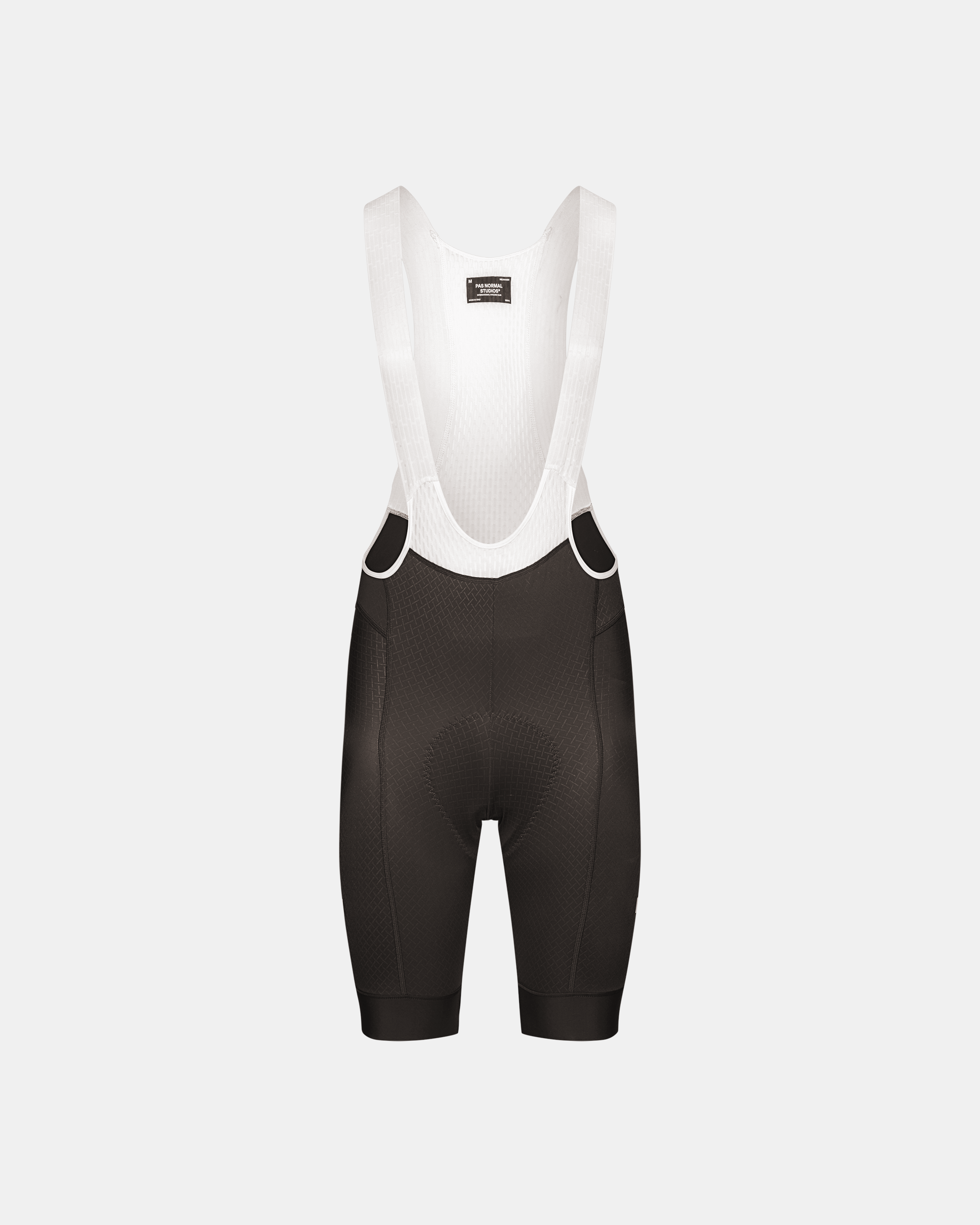 Dark Grey Mechanism cycling bibs, front flat lay with white mesh bib straps