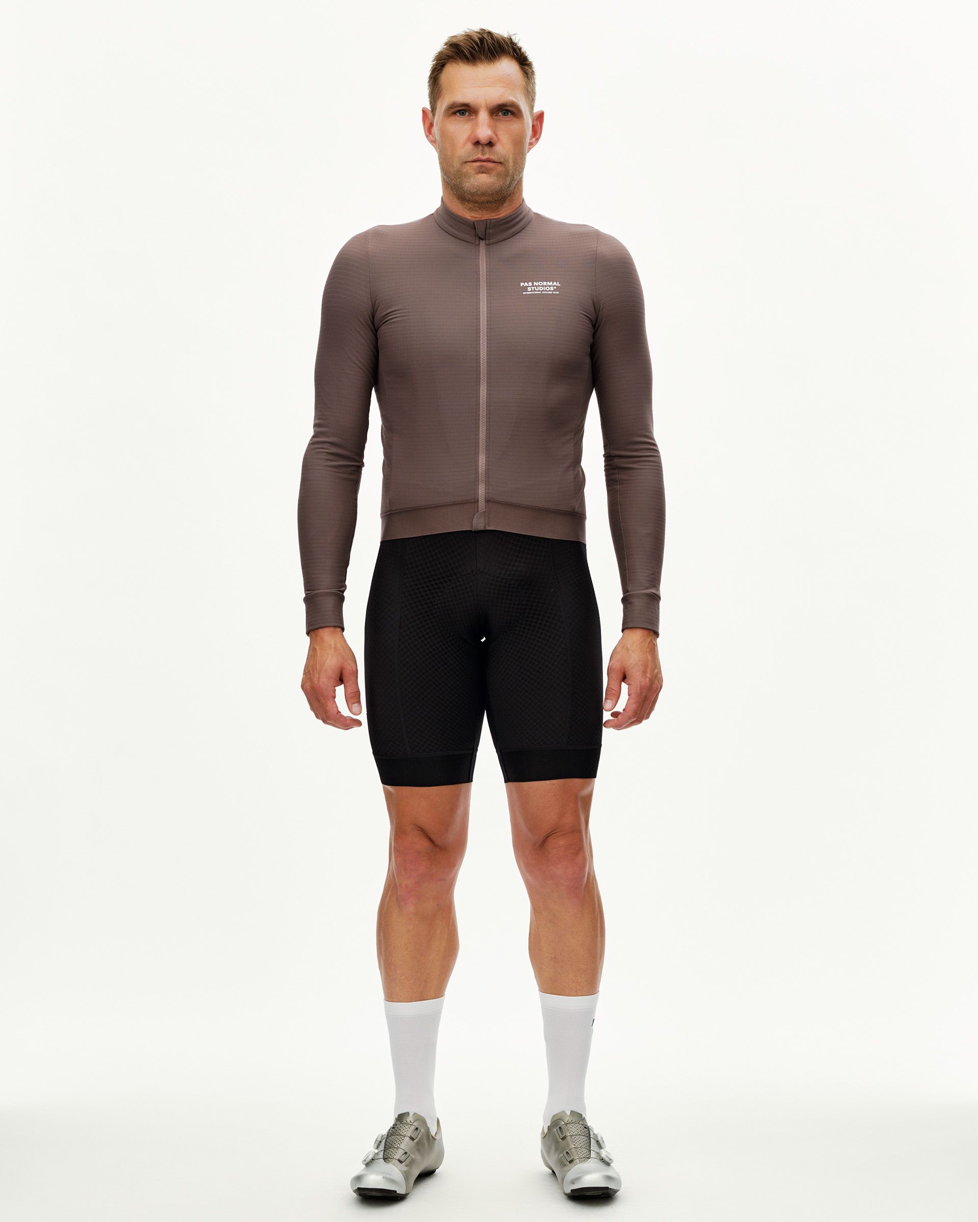 Dusty Plum Essential long sleeve cycling jersey on model, front view with full zip and ribbed cuffs