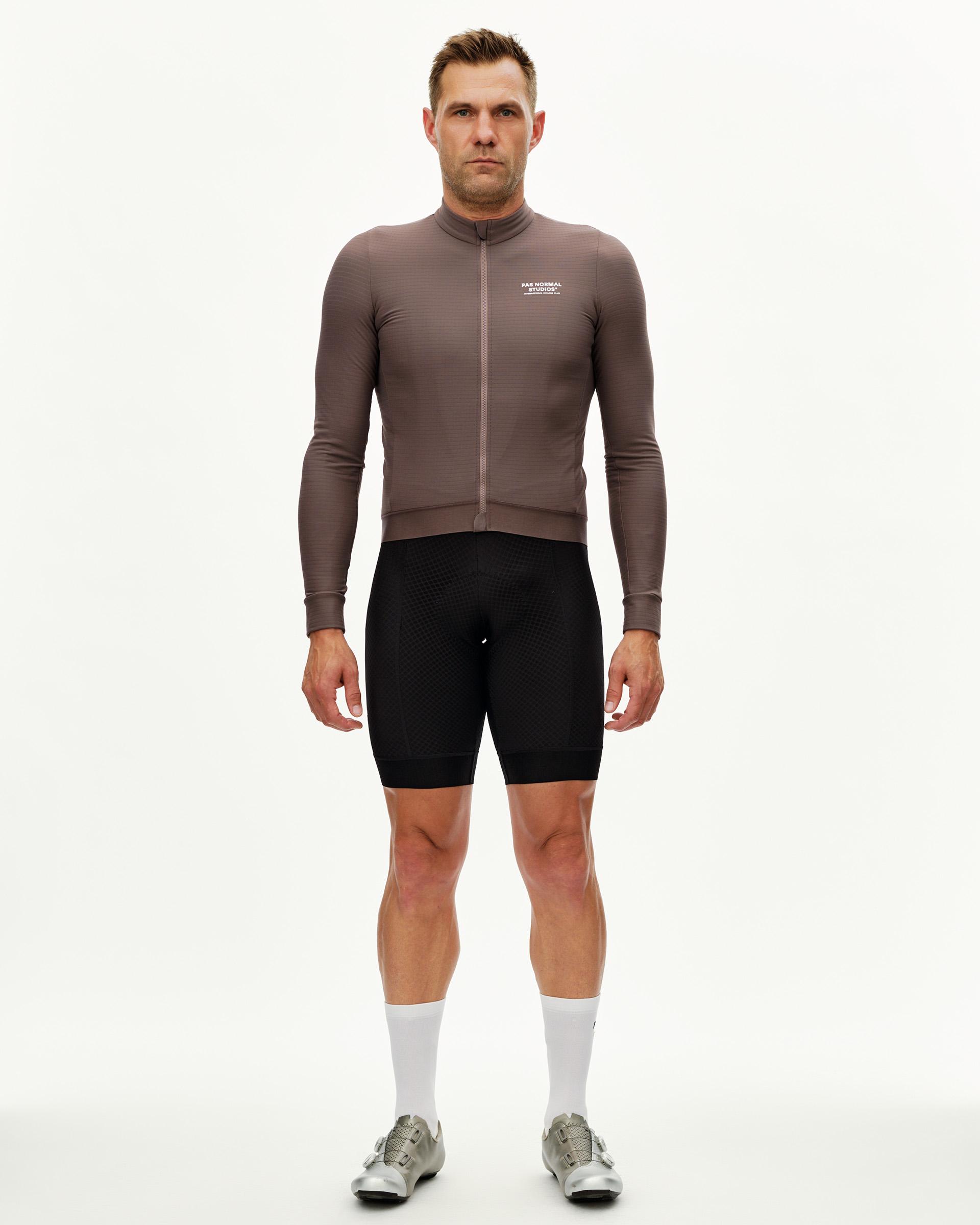 Dusty Plum Essential long sleeve cycling jersey on model, front view with full zip and ribbed cuffs
